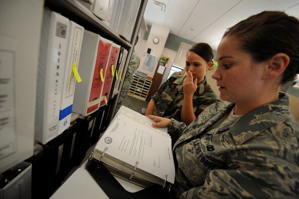 MOODY AIR FORCE BASE, Ga. -- Airman 1st Class Rebecca Roberts, 23rd Communications Squadron records manager technician, goes over Airman 1st Class Amanda Johnson's file plan during a staff assistance visit here July 23. Airman Johnson is from the 23rd Aeromedical Dental Squadron's bioenviromental engineering flight. (U.S. Air Force photo by Senior Airman Gina Chiaverotti)