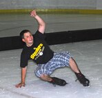MINOT, N.D. – Airman Mike Anzelone, 5th Operations Support Squadron aviation resource manager, falls after attempting a tricky maneuver while skating at the West Rink in the Maysa Arena in Minot, N.D. A group of Minot Airmen escaped the heat and enjoyed an afternoon of ice skating July 27. The group of Airmen gather together every Sunday for open skating from 3 p.m. to 6 p.m. and enjoy a casual meal afterward. If you know someone who is interested in joining the group, please contact Airman 1st Class Benjamin Stratton at 906-281-6996 or Senior Airman Stephanie Campbell at 701-340-2658. (U.S. Air Force photo by Airman 1st Class Benjamin Stratton)