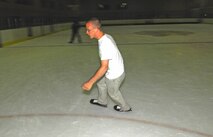MINOT, N.D. – Airman Nick Clum, 5th Operations Support Squadron aviation resource manager, demonstrates how to successfully complete crossovers while ice skating at the West Rink in the Maysa Arena in Minot, N.D. Airman Clum joined other Minot Airmen at the rink July 27 to enjoy the comradery of fellow Airmen, escape the heat and brush up on his ice skating skills. The group of Airmen gather together every Sunday for open skating from 3 p.m. to 6 p.m. and enjoy a casual meal afterward. (U.S. Air Force photo by Airman 1st Class Benjamin Stratton)