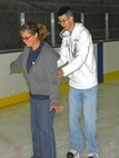 MINOT, N.D. – Airman 1st Class Justin Palmer, 5th Aircraft Maintenance Squadron crew chief, helps Tarah Mayer, a Willow City, N.D., native, learn the art of ice skating. Minot Airmen escaped the heat and enjoyed an afternoon of ice skating July 27 at the West Rink in the Maysa Arena in Minot, N.D. The group of Airmen gather together every Sunday for open skating from 3 p.m. to 6 p.m. and enjoy a casual meal afterward. If you know someone who is interested in joining the group, please contact Airman 1st Class Benjamin Stratton at 906-281-6996 or Senior Airman Stephanie Campbell at 701-340-2658. (U.S. Air Force photo by Airman 1st Class Benjamin Stratton)