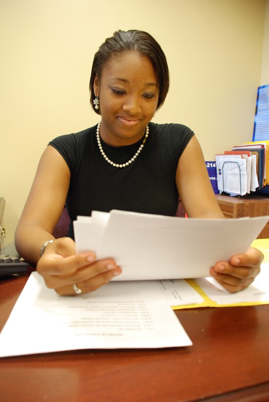 Chavery McClanahan reads over some paperwork in the 316th Wing Judge Advocate office. She is a 20-year-old North Carolina Central University student and is working in the Judes Advocate office here at Andrews as a volunteer.