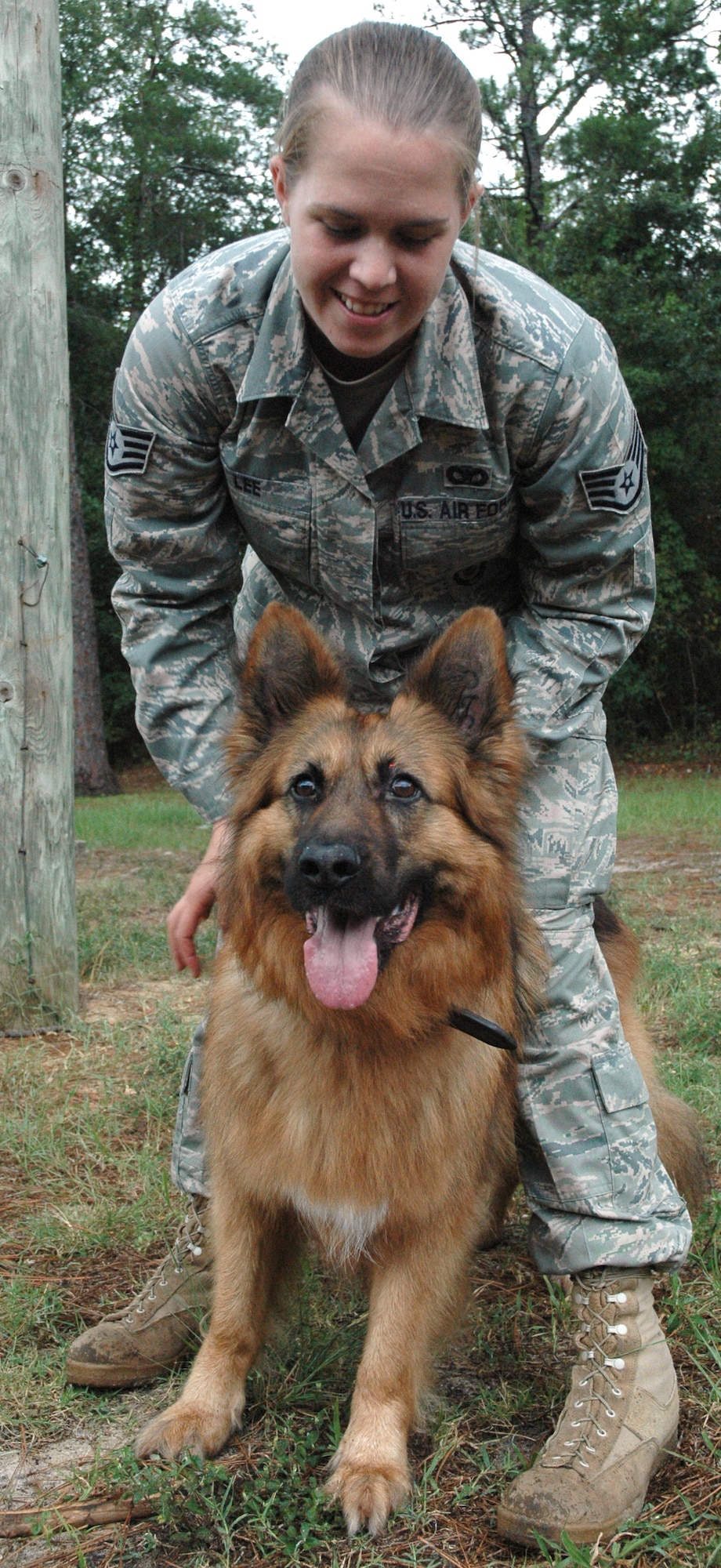 EGLIN AIR FORCE BASE, Fla. -- Max, a retired Air Force military working dog for the 96th Security Forces Squadron, anxiously waits to attack before Staff Sgt. Kathleen Lee, 96th SFS MWD handler, releases him. (US Air Force photo/ Airman 1st Class Anthony Jennings