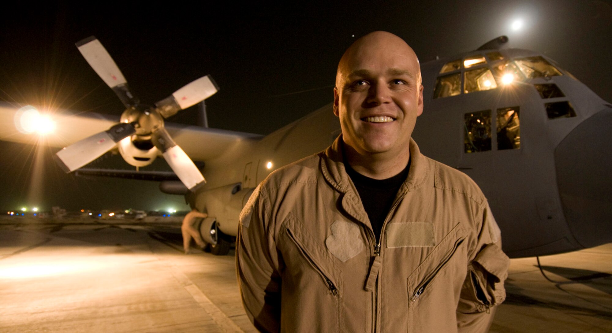 Tech. Sgt. Justin Jackson, 41st Expeditionary Electronic Combat Squadron mission crew supervisor, poses for a photo in front of an EC-130H Compass Call here on July 15, 2008. This photo was taken just prior to a sortie in which Sergeant Jackson hit his 2,000th combat flying hour. Sergeant Jackson is deployed from the 42nd Electronic Combat Squadron, Davis-Monthan Air Force Base, Ariz., and hails from Colorado Springs, Colo. (U.S. Air Force photo by Staff Sgt. Samuel Morse)