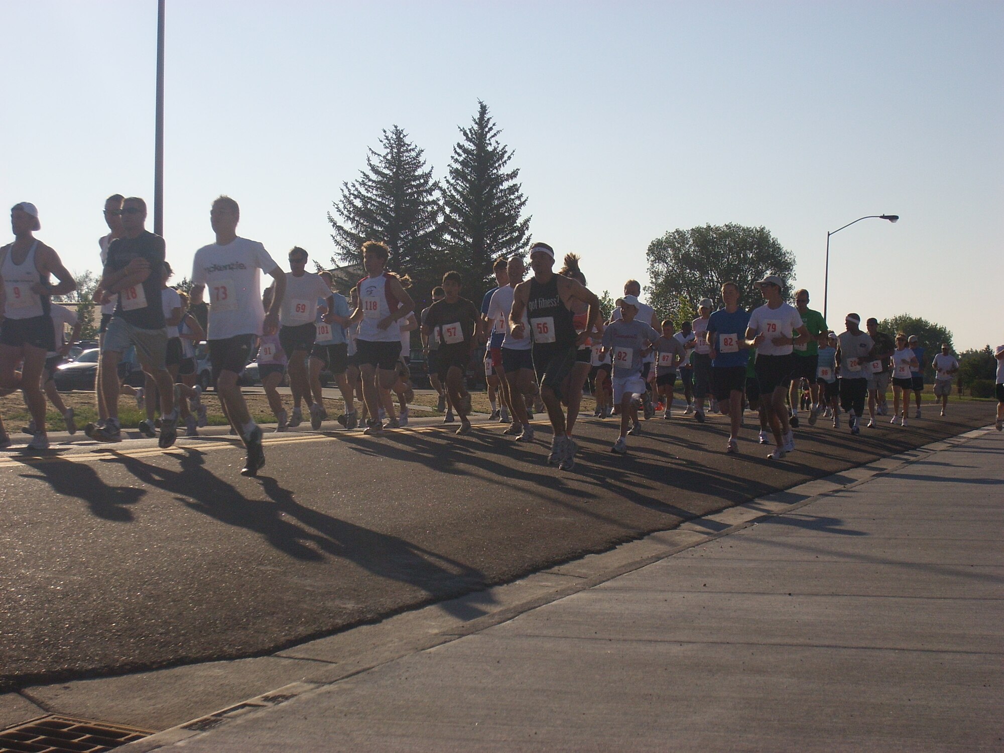 Runners depart the start line of the 30th Annual 5K/10K Buffalo Stampede run and walk here Saturday. Awards were given to the top three male and female participants (Photo by Tech. Sgt. Kurt Arkenberg). 
