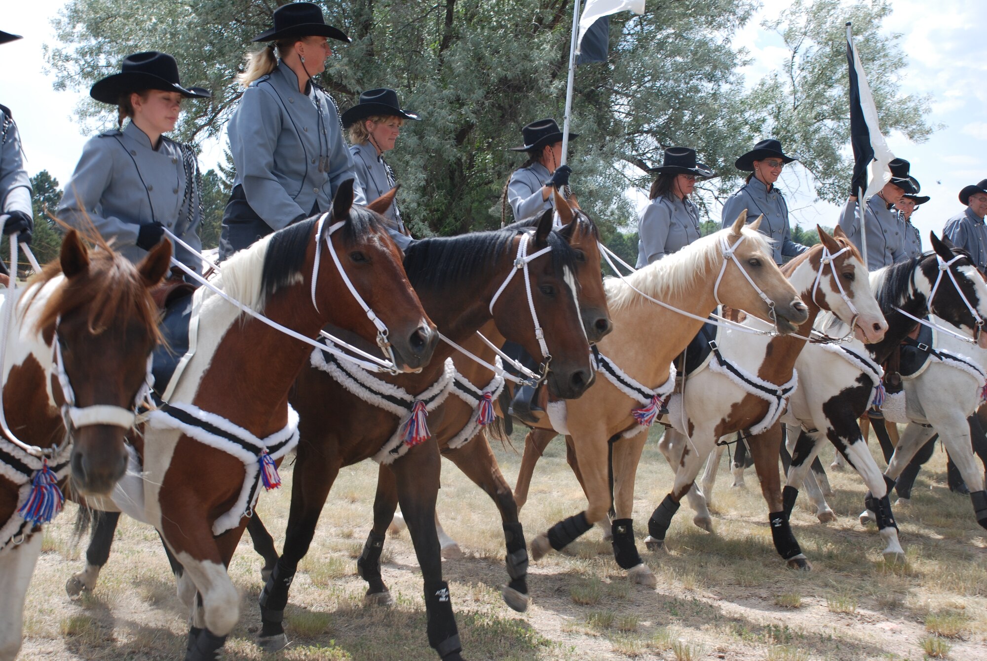 Cavalry Trotters perform historical precision riding drills during the Annual Fort D.A. Russell Days open house July 18. The three-day event occurs in conjunction with Cheyenne Frontier Days, and allows the public to see World War II re-enactments, historical displays, historic homes tours and missile mission tours. The United States Air Force Academy Band also performed at the event (Photo by Airman 1st Class Daryl Knee).