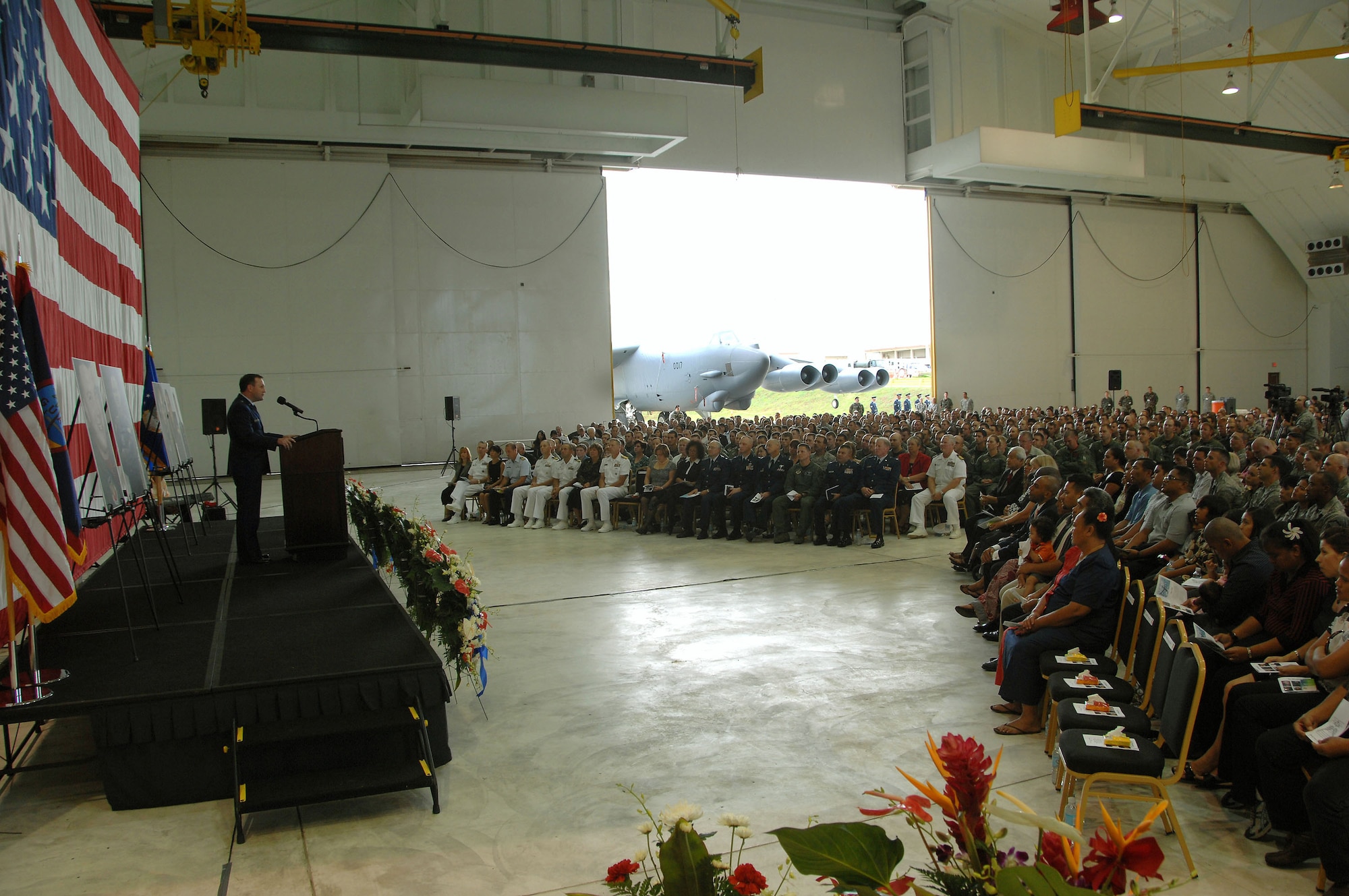 Brig. Gen. Doug Owens, 36th Wing commander, delivers a heartfelt message to more than 1,800 guests who attended a memorial ceremony July 25 at Andersen's Hangar One. The ceremony honored the six Airmen who died when their B-52 crashed July 21, 25 miles off the coast of Guam. Their mission was to flyover Guam's Liberation Day parade celebrating the island's liberation from Japanese occupation in World War II. (U.S. Air Force photo/Airman 1st Class Courtney Witt) 