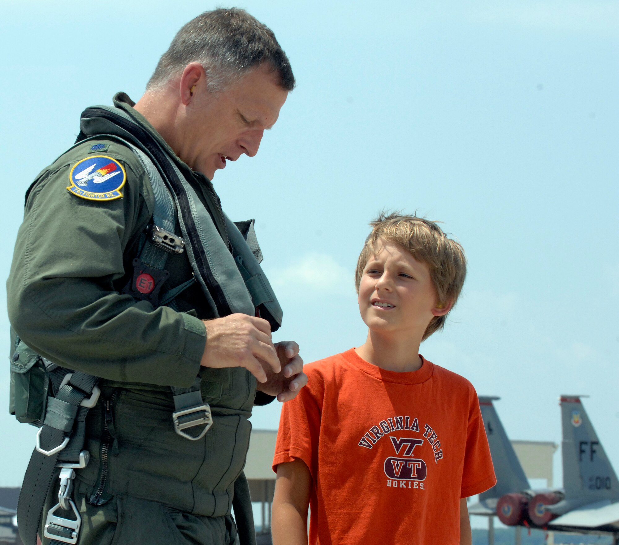 LANGLEY AIR FORCE BASE, Va. -- Lt. Col. Ed Corcoran, 71st Fighter Squadron commander, is greeted by his son Sean after returning from Combat Archer July 26.  Combat Archer is an air-to-air system evaluation in which pilots test the reliability and effectiveness data of aircraft and missiles and complete required training for their Air Expeditionary Force cycle.   (U.S. Air Force photo/Senior Airman Vernon Young) 
