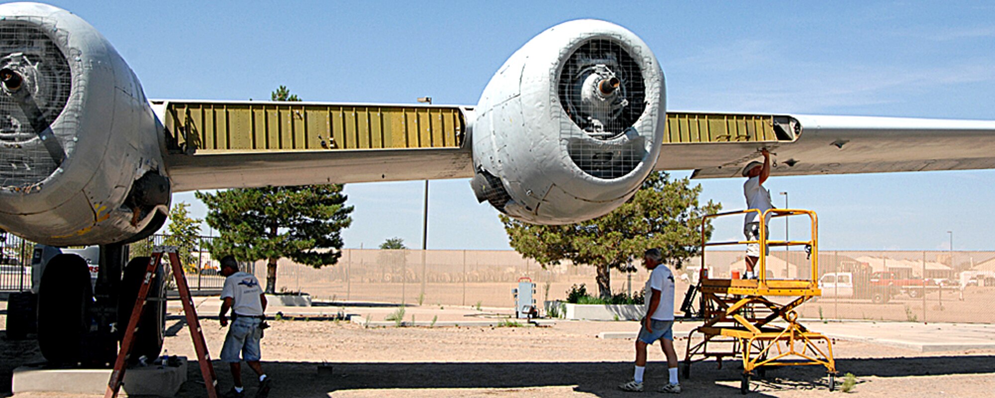 Workers take apart the World War II B-29 bomber which will be housed in the new National Museum for Nuclear Science and History under contruction near Eubank Boulevard and Southern Street, about 2 miles from Kirtland AFB.  The aircraft has been on display at the old Atomic Museum location on Wyoming Boulevard across from 377th Air Base Wing headquarters.  U.S. Air Force photo by Helga Carter