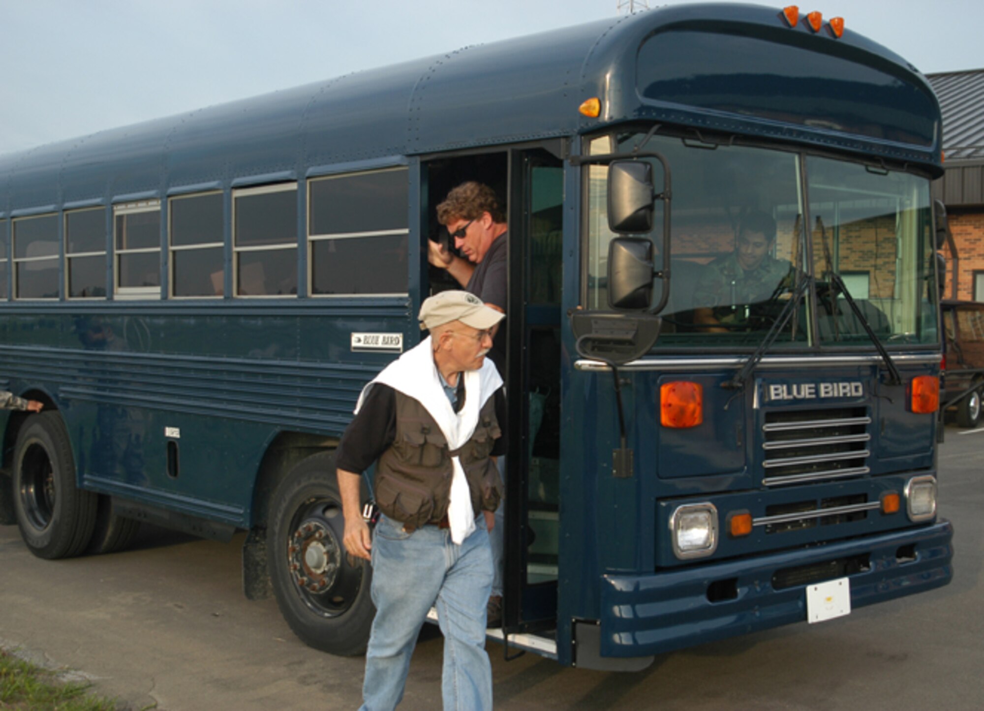GRISSOM AIR RESERVE BASE, Ind., -- Professor Ephraim Fischbach (front), Purdue University physics department, and Mr. Jere Jenkins, from the nuclear engineering department, depart the bus for a stop at base operations.  While there, they received a weather briefing prior to heading to a KC-135R Stratotanker that would take them and other members of their research team to Thule Air Base, Greenland.  (U.S. Air Force photo/Lt. Col. Gary Lockard)                                