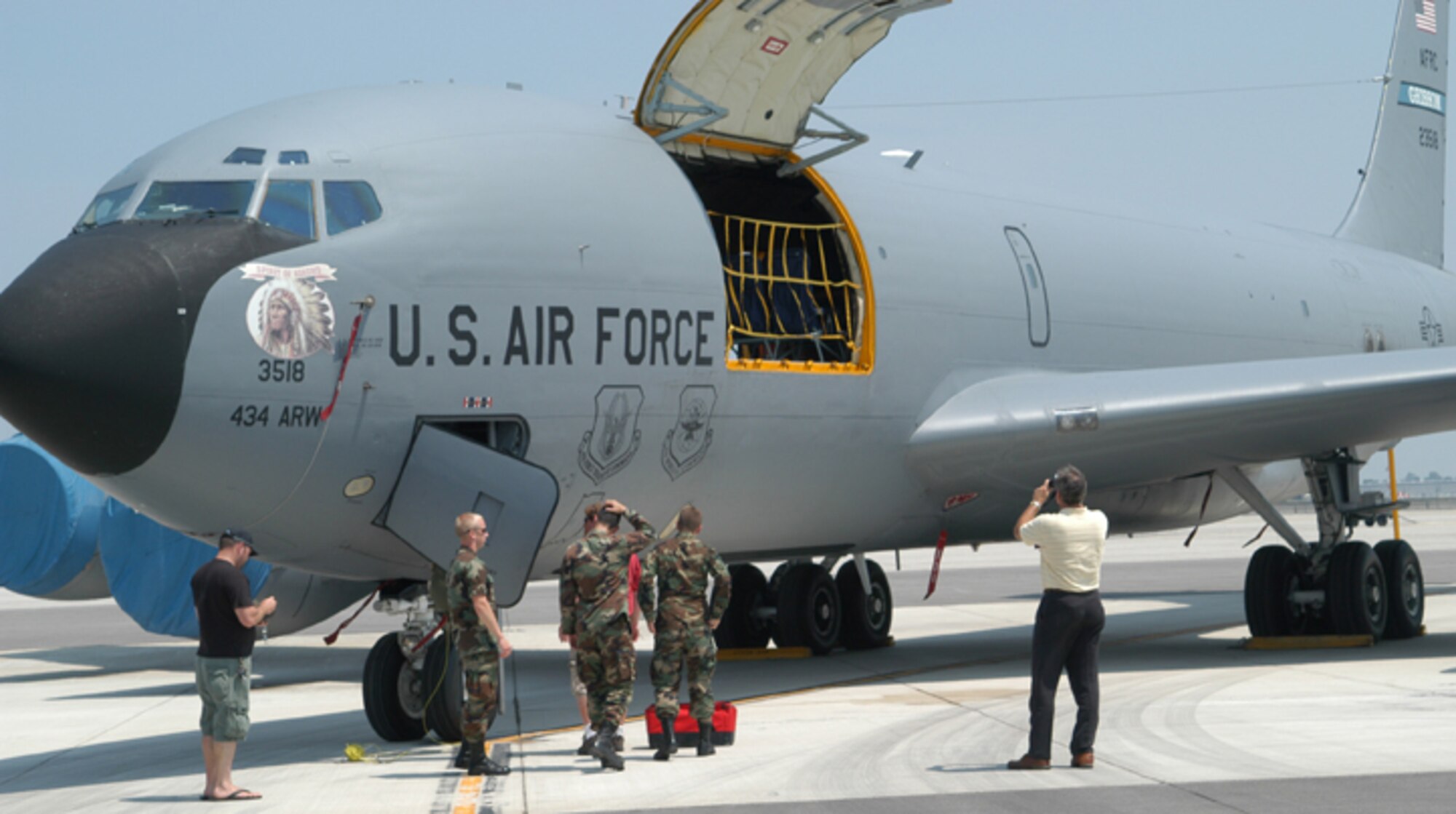 GRISSOM AIR RESERVE BASE, Ind., -- Some of the members of the Purdue University - Air Force Academy research team get their first look at a KC-135R Stratotanker.  The team was provided airlift to Thule Air Base, Greenland, via a KC-135R from the 434th Air Refueling Wing.  While in Greenland, the team will study the behavior of electronic systems during a solar eclipse.  (U.S. Air Force photo/Lt. Col. Gary Lockard)                                