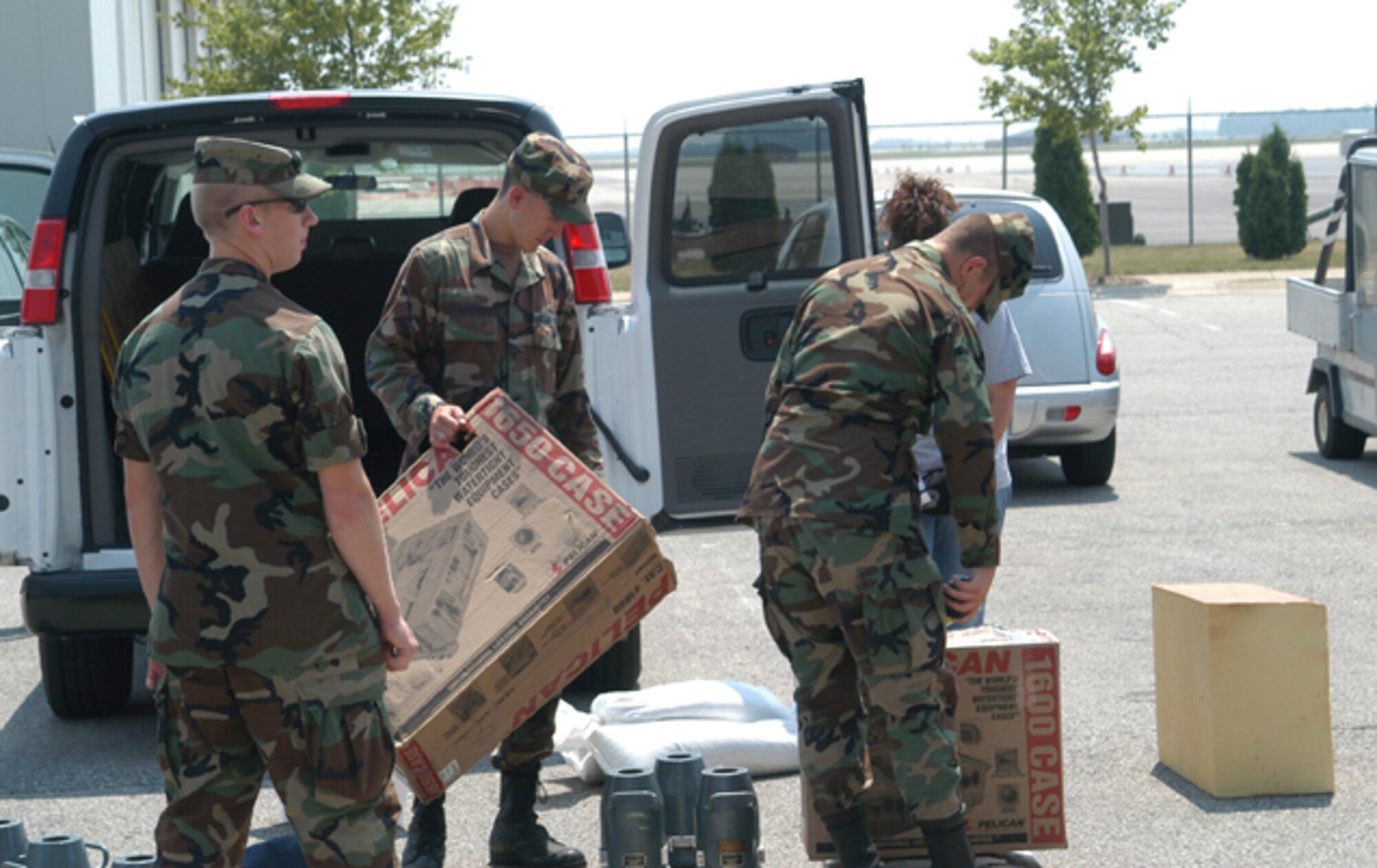 GRISSOM AIR RESERVE BASE, Ind., --  Members of a combined Purdue University - Air Force Academy research team begin to unload their equipment after arriving at Grissom.  Airlift to Thule Air Base, Greenland, was provided by a KC-135R Stratotanker from the 434th Air Refueling Wing.  The team will conduct research during an upcoming solar eclipse.  (U.S. Air Force photo/Lt. Col. Gary Lockard)                       