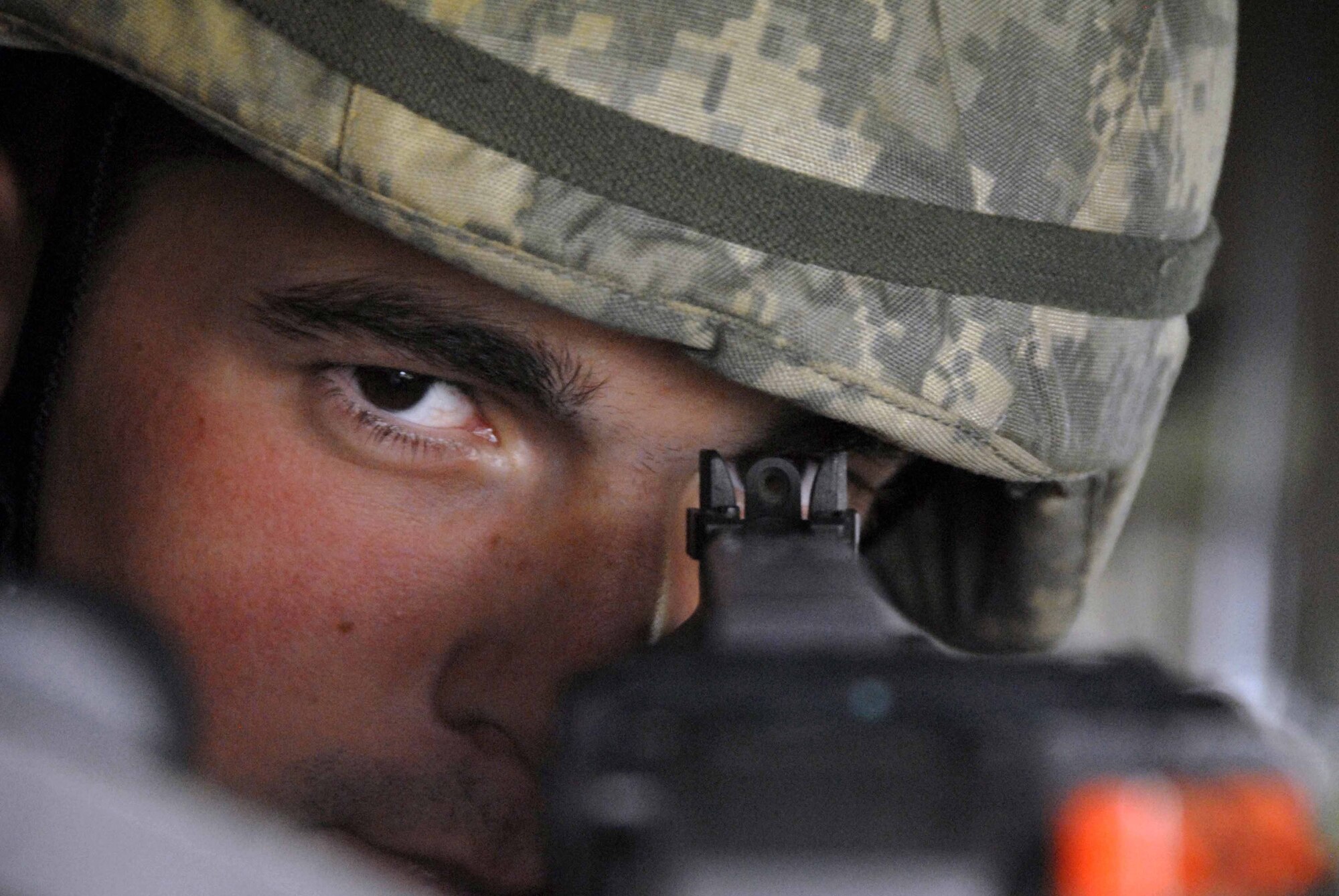 Airman 1st Class David Armes aims his M240B General Purpose Machine Gun  during a base-wide exercise July 21 at Osan Air Base, South Korea. Airman Armes is an entry controller assigned to the 51st Security Forces Squadron. (U.S. Air Force photo/Senior Airman Christopher Boitz) 