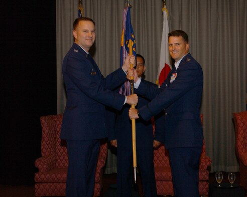 Lt.Col. J. Kelly Klein receives command of the 374th Medical Support Squadron   during a change of command ceremony on 25 July.(United States Air Force by Airman Devin Doskey)                                                     