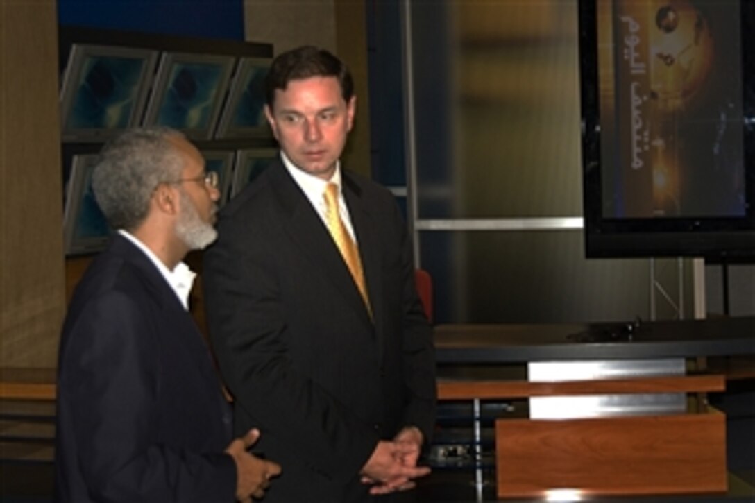 Robert Hastings, right, principal deputy assistant secretary of defense for public affairs, tours the Al Jazeera Channel facilities in Southwest Asia with Ayman Jaballah, the channel's deputy chief editor, July 27, 2008. 