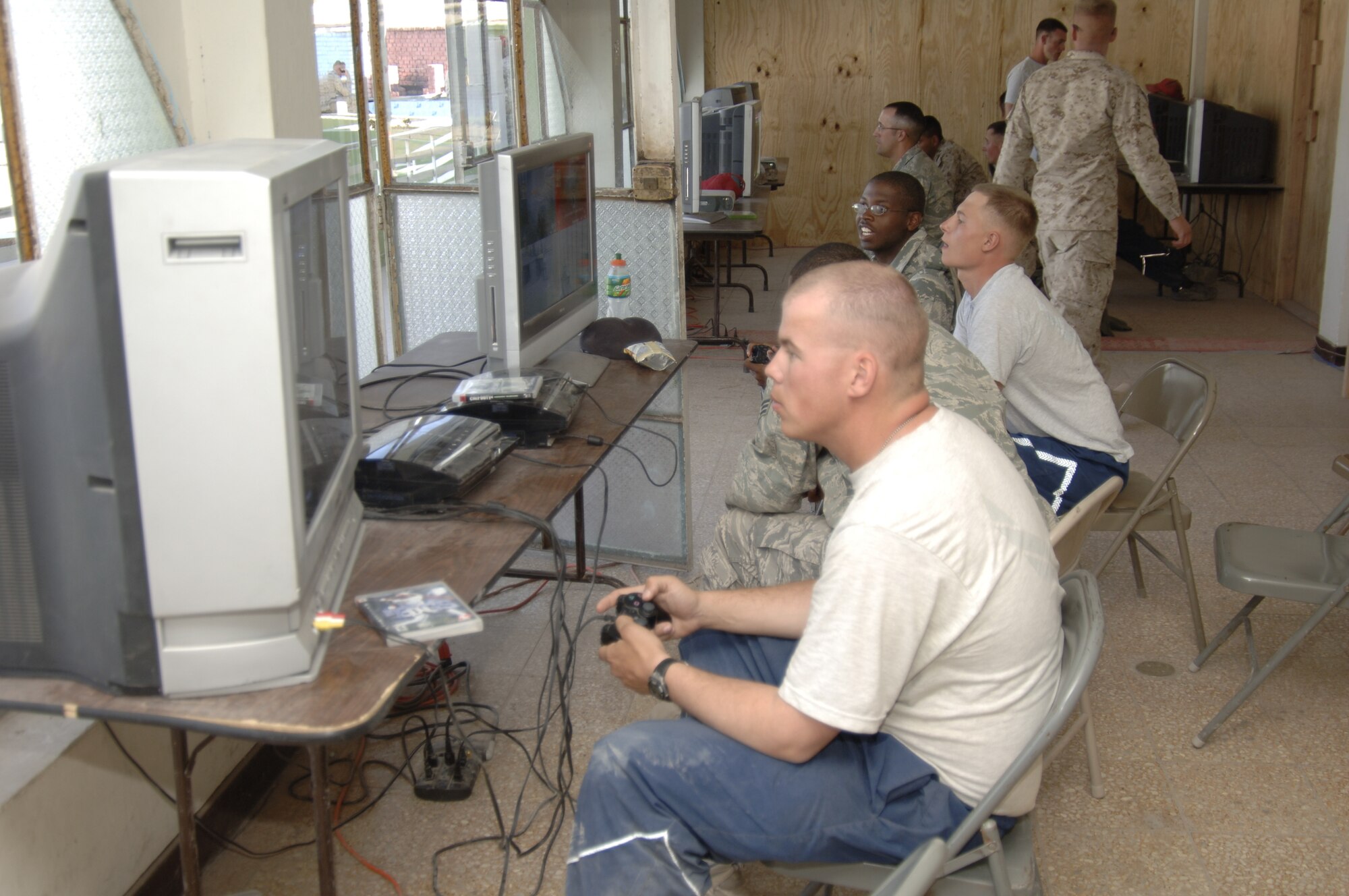 Task Force New Horizon members enjoy a break from their every day deployment duties by playing video games in the Morale, Welfare and Recreation area, July 28.  Air Force Services provide task force members the opportunity to play video games, watch movies, go on trips to downtown Ayacucho, surf the Internet and call home.  (U.S. Air Force photo/Capt. David Tomiyama)