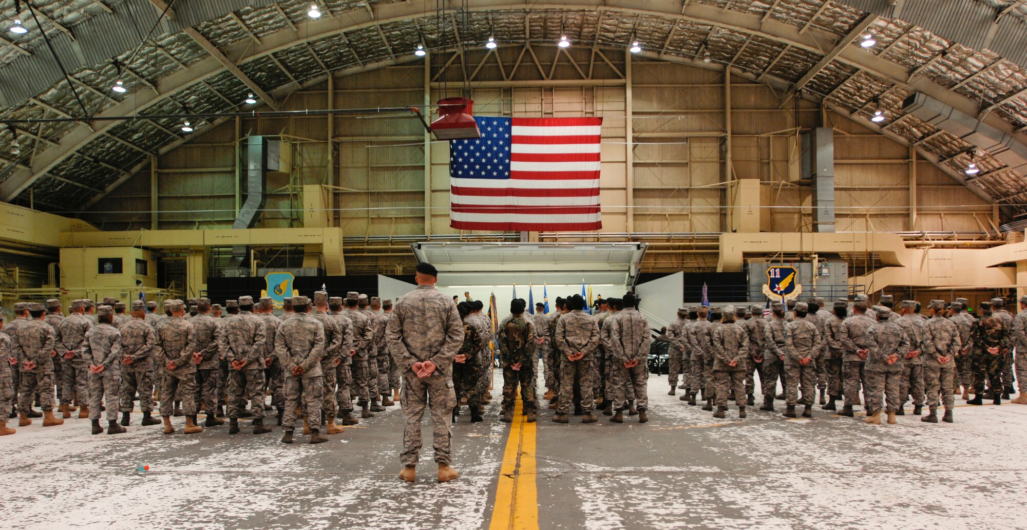ELMENDORF AIR FORCE BASE, Alaska -- Flights of Airmen stand at parade rest during the 3rd Mission Support Group change of command at Hangar 1 July 18. (U.S. Air Force photo/Airman 1st Class Tinese Treadwell)