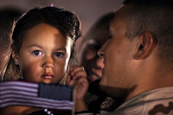 Staff Sgt. Anthony Cathcart, 28th Aircraft maintenance squadron aerospace maintenance jouneyman, is greeted by his daughter Payton, and wife, Jaclyn, July 29. Sergeant Cathcart was one of approximately 300 Airmen who returned home from a six-month deployment from Southwest Asia. (U.S. Air Force photo/Airman Corey Hook) 