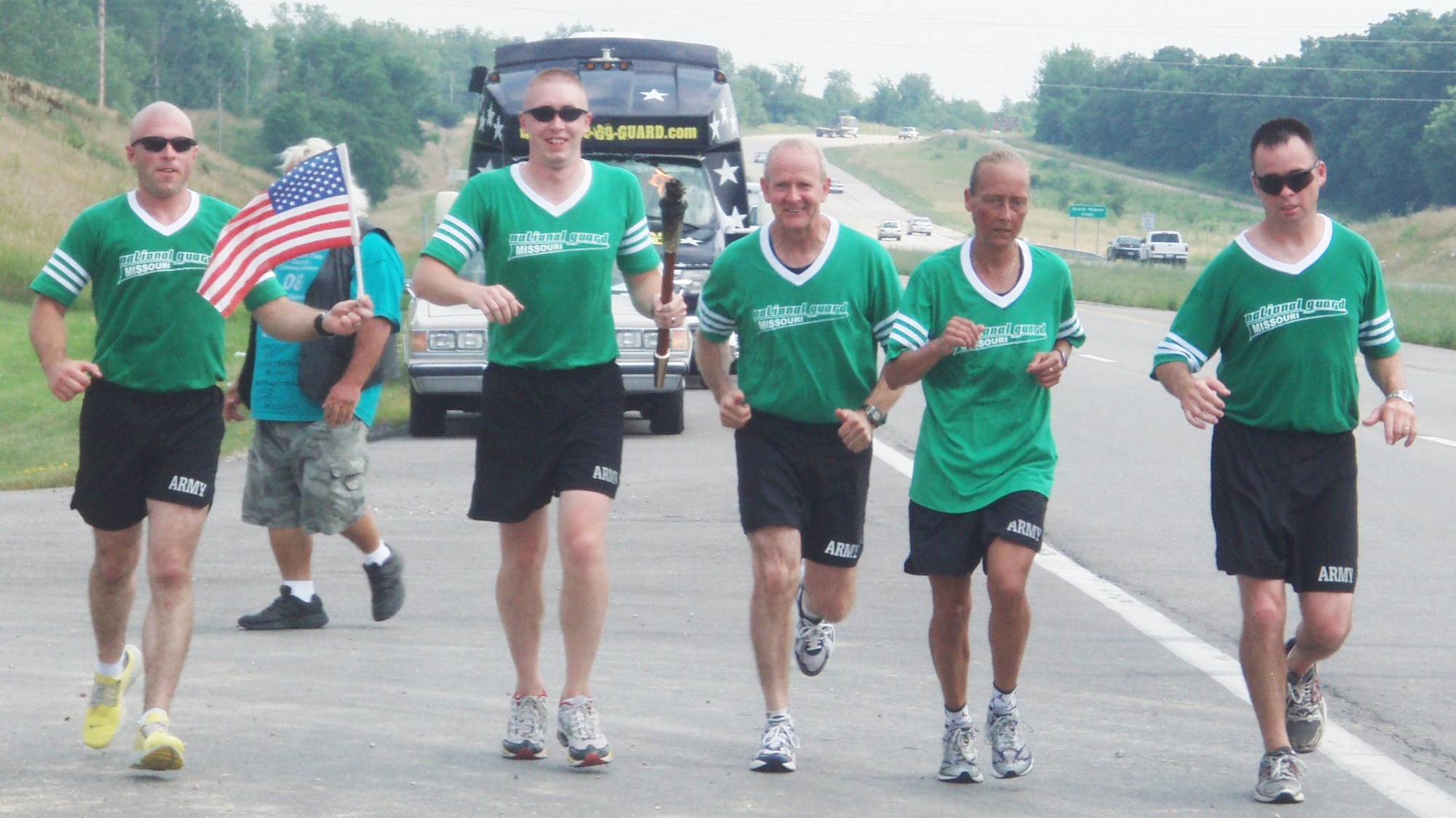 COLUMBIA, Mo. - (Left to right) Sgt. 1st Class Jamie Turner, Army 2nd Lt Cody Anfinson, Warrant Officer Roger Fillmer, Army Staff Sgt. Michelle Elliot and Sgt 1st Class Kannon John run the remaining few miles to the KOMU Channel 8 building in Columbia. (U.S. Army photo/Michelle Queiser)
