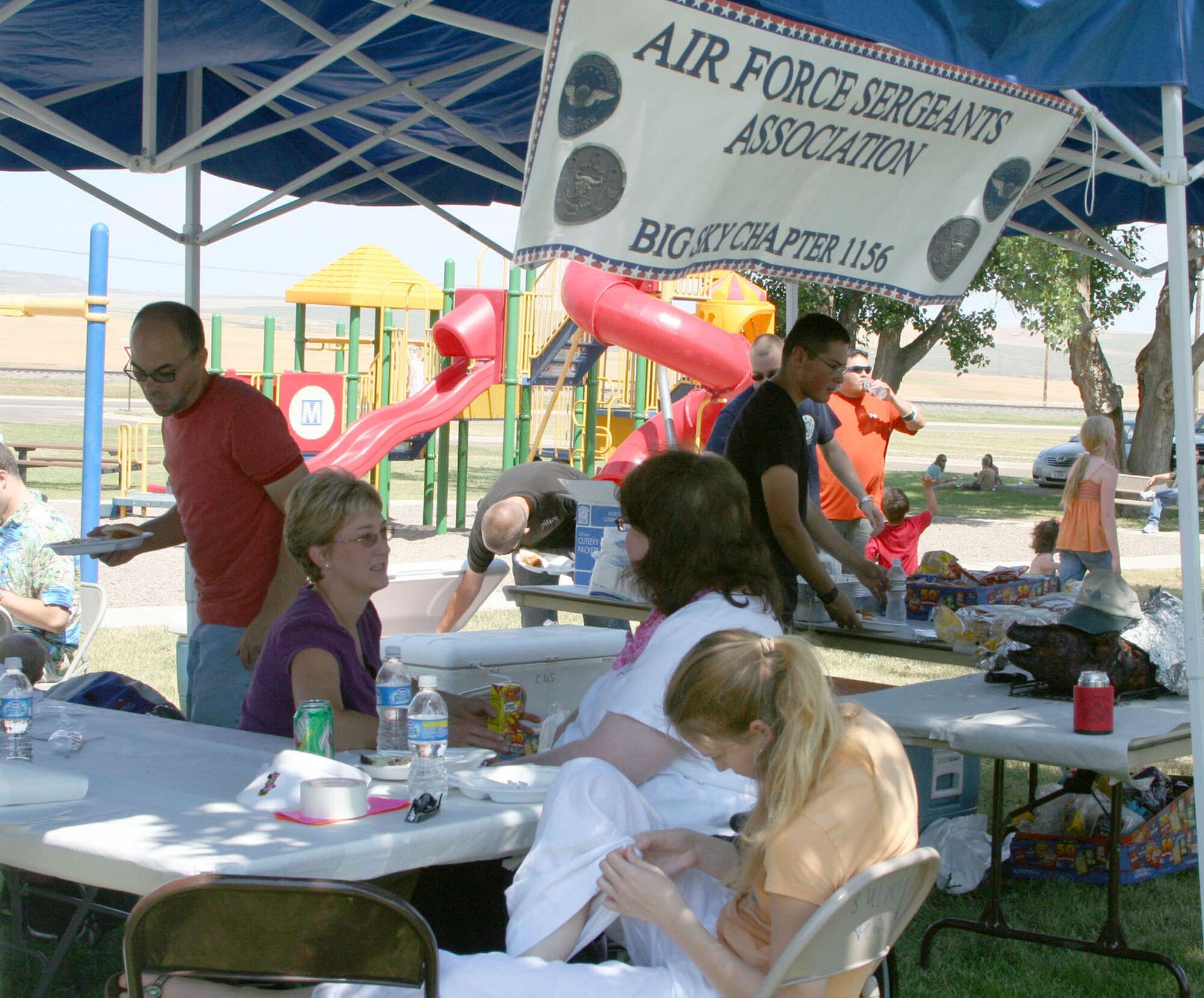 More than 180 people participated in the free Air Force Sergeants Association picnic July 26 at Sun Park Plaza.  The AFSA Chapter 1156 hosted a pig roast and family picnic featuring music, an inflatable obstacle and a barbeque grill raffle which raised more than $680 for the chapter. (U.S. Air Force photo/Senior Airman Eydie Sakura) 