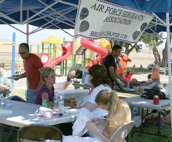 More than 180 people participated in the free Air Force Sergeants Association picnic July 26 at Sun Park Plaza.  The AFSA Chapter 1156 hosted a pig roast and family picnic featuring music, an inflatable obstacle and a barbeque grill raffle which raised more than $680 for the chapter. (U.S. Air Force photo/Senior Airman Eydie Sakura) 