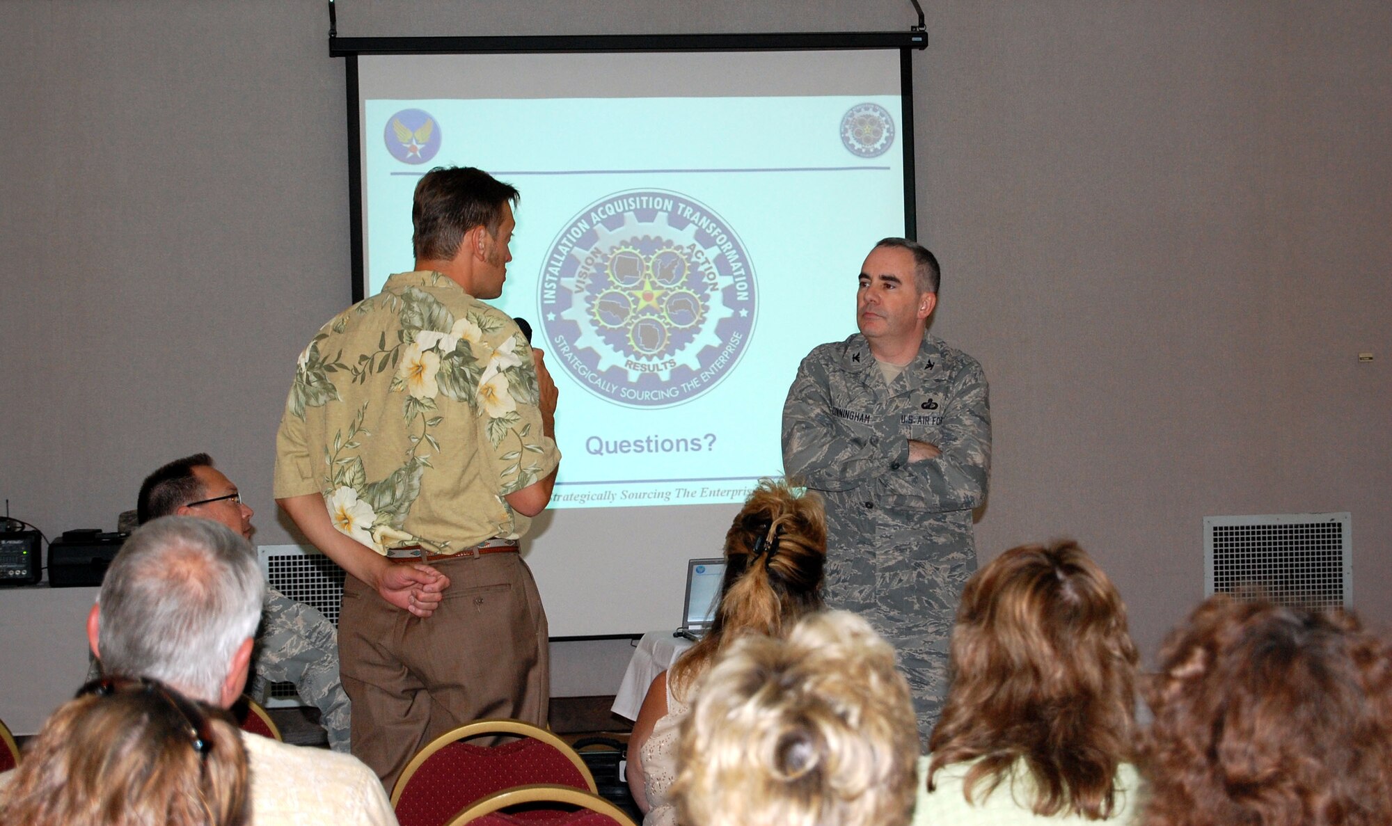 A local community member asks Col. Harold Cunningham a question following his briefing to small business owners in Great Falls on the changes that will be coming to the Air Force contracting procedures in 2010. Colonel Cunningham is the 790th Installation Acquisition Group provisional director. (U.S. Air Force photo/Valerie Mullett)