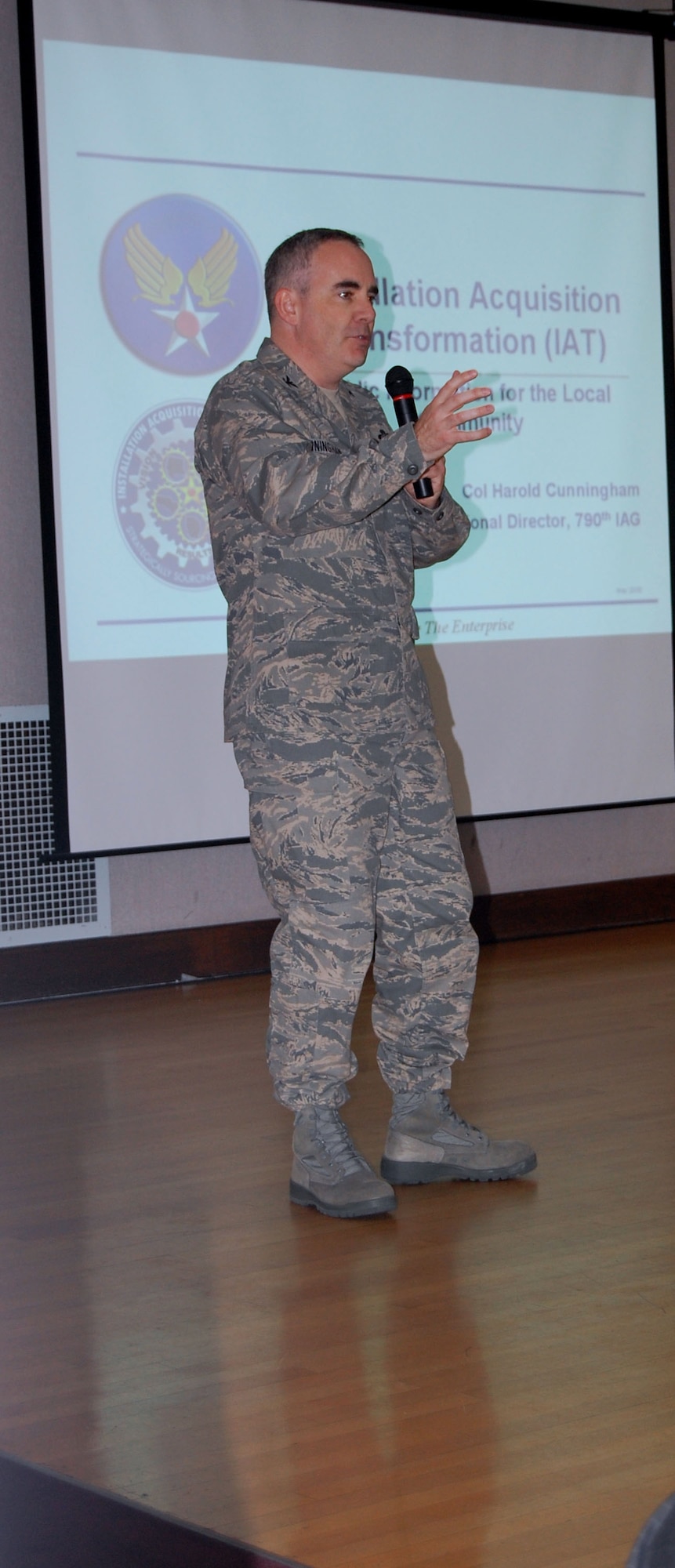 Col. Harold Cunningham introduces himself before the start of a Town Hall meeting with small business owners in Great Falls July 27. He is the 790th Installation Acquisition Group provisional director and led discussions at the Civic Center on upcoming changes that will affect the Air Force's contracting procedures. (U.S. Air Force photo/Valerie Mullett)