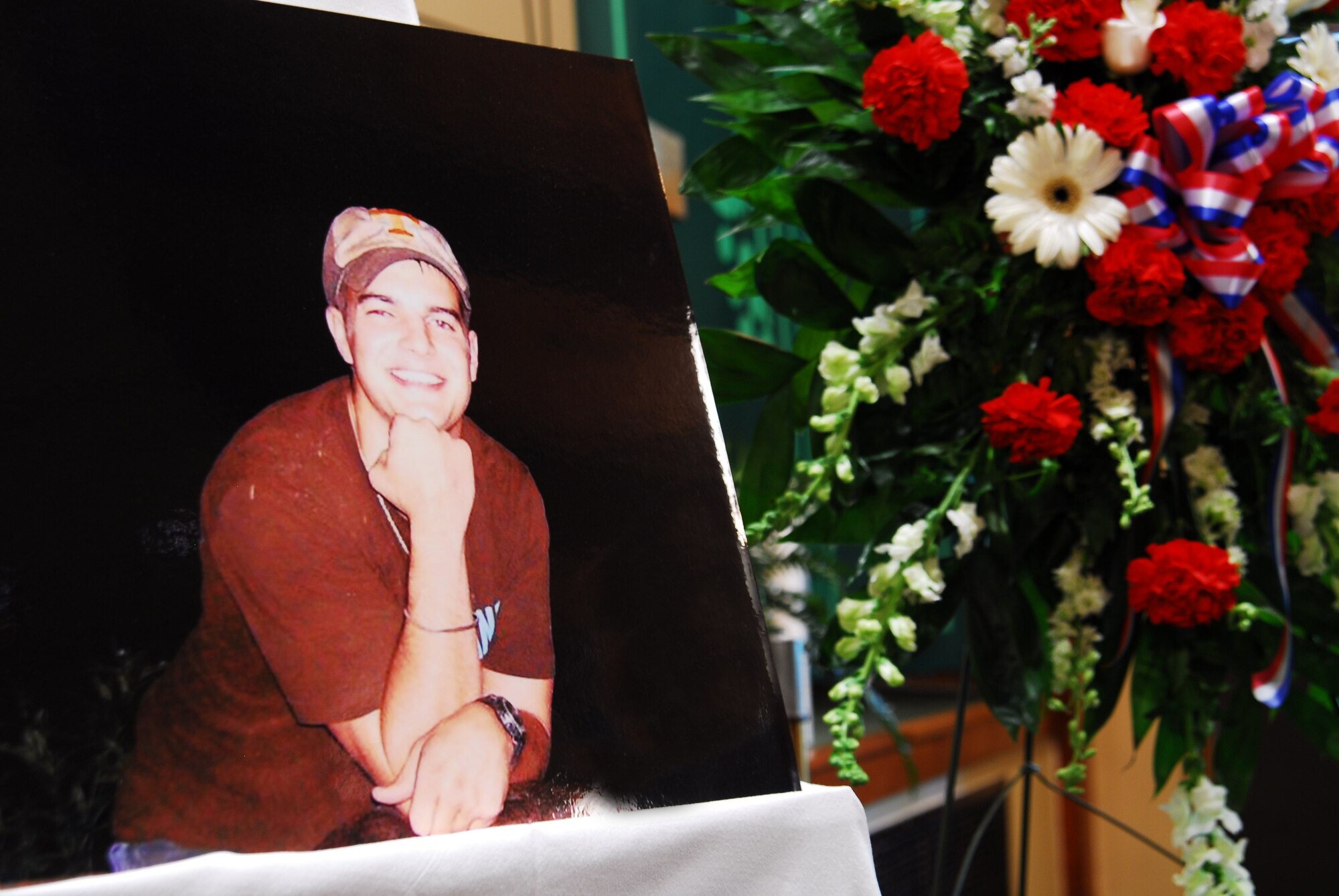 A photograph of Staff Sgt. James Willis is displayed during a memorial service at the Hurlburt Field Chapel July 29. Sergeant Willis, who was assigned to the 4th Aircraft Maintenance Unit, died July 19 after being struck by lightning. (U.S. Air Force photo/Senior Airman Sheila deVera)