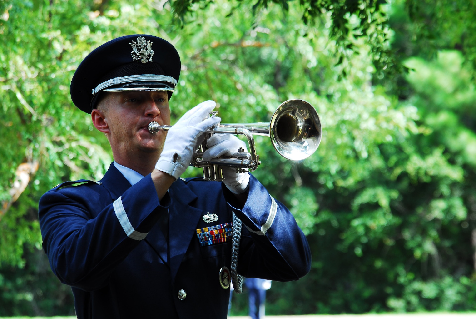 A member of the Hurlburt Field Honor Guard plays Taps during the memorial service for Staff Sgt. James Willis at the Hurlburt Field Chapel July 29. Sergeant Willis, who was assigned to the 4th Aircraft Maintenance Unit, died July 19 after being struck by lightning. (U.S. Air Force photo/Senior Airman Sheila deVera)