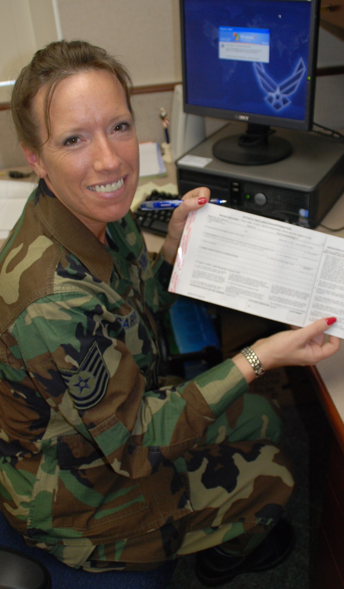 It won't be long before the November ballot box is ready.  932nd Airlift Wing member Tech. Sgt. Ava Carpenter fills out an absentee voting form which is also located online along with easy to understand information at:  http://www.fvap.gov/
