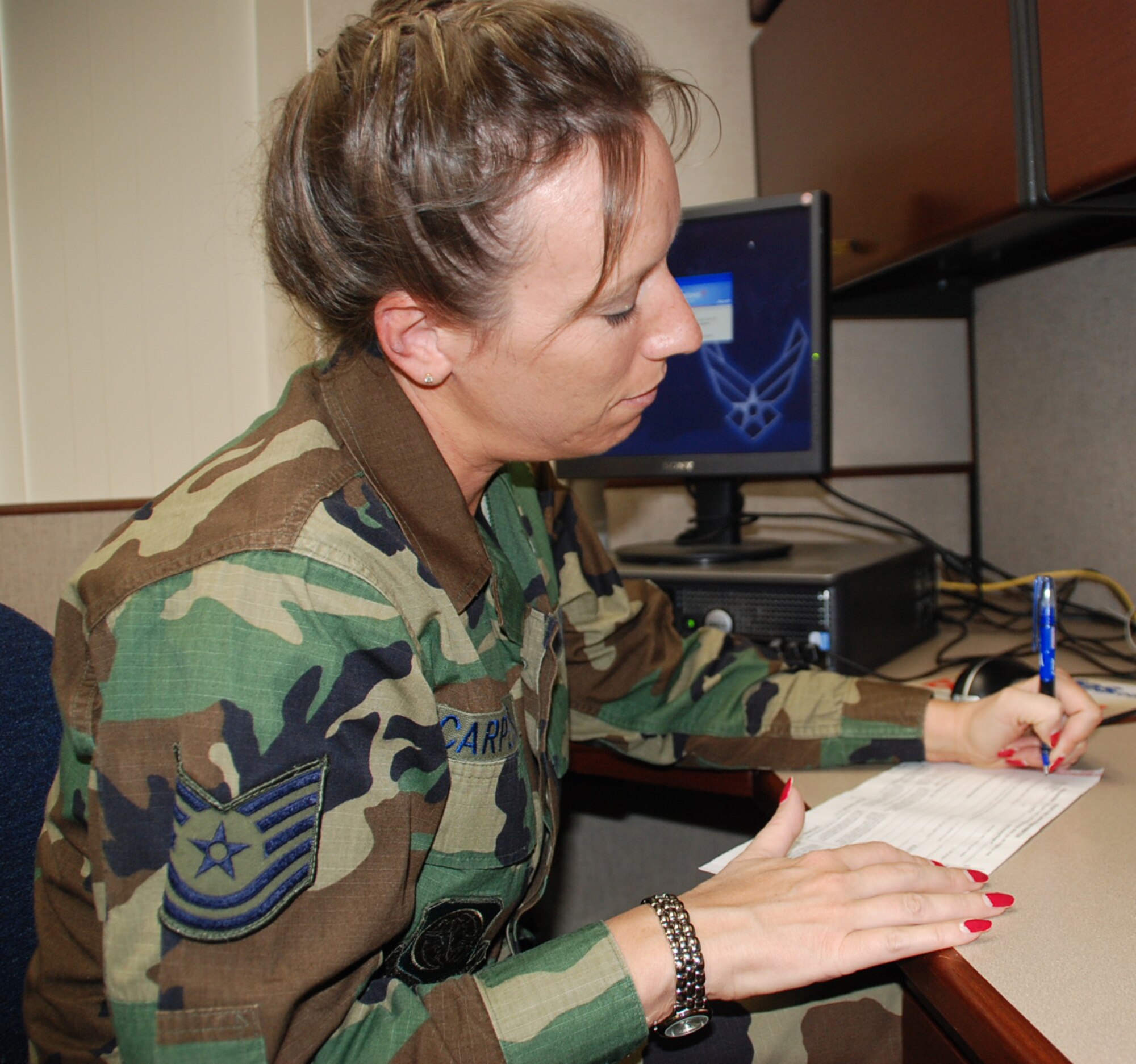 932nd Airlift Wing encourages members to vote.  Air Force Reserve Command member Tech. Sgt. Ava Carpenter fills out an absentee voting form.  encourage voters to use our new tool, now available on our website, to complete the Voter Registration and Absentee Ballot Request Form using only the specific information they need for their state. Voters from participating states and jurisdictions may also elect to use the feature to send a completed, signed, and scanned Registration and Ballot Request Form to their local election office and receive their blank ballot online via a secure server. The tool uses a multi-layer approach to security which ensures that the voter’s personal information is not viewed by anyone except the intended recipient. These advancements will provide military and overseas voters an easier way to register and request absentee ballots, as well as another alternative to the by-mail process of absentee voting, without sacrificing the security of the voter’s identity. 
It is also located online along with easy to understand information at:  http://www.fvap.gov/  