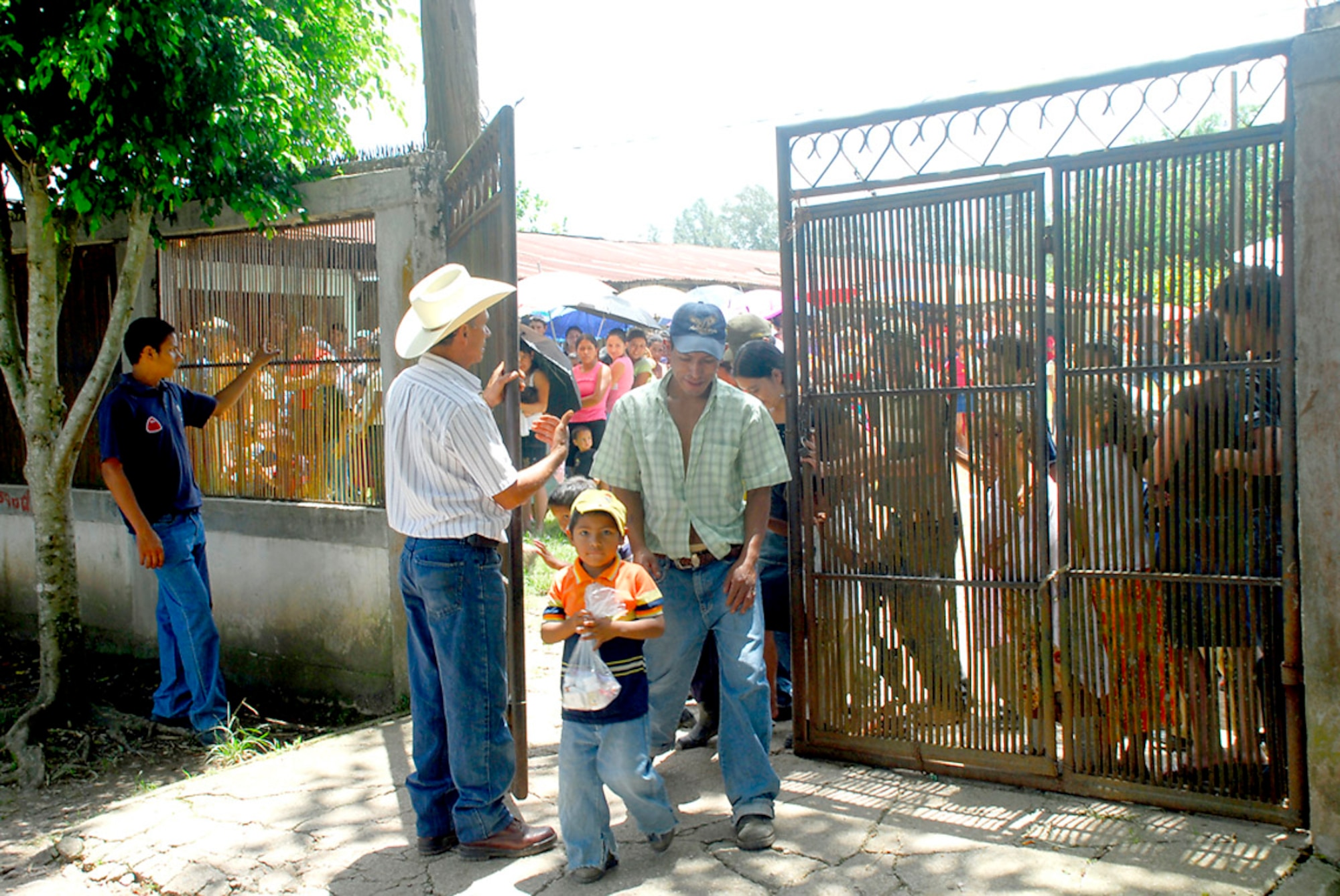 A Honduran local, Juan Ruiz, controls the flow of traffic in and out of a clinic during a medical readiness training exercise in Santa Barbara, Honduras, July 25. More than 740 people attended the MEDRETE for access to free medical care and preventative health measures. (U.S. Air Force photo/Staff Sgt. Joel Mease)