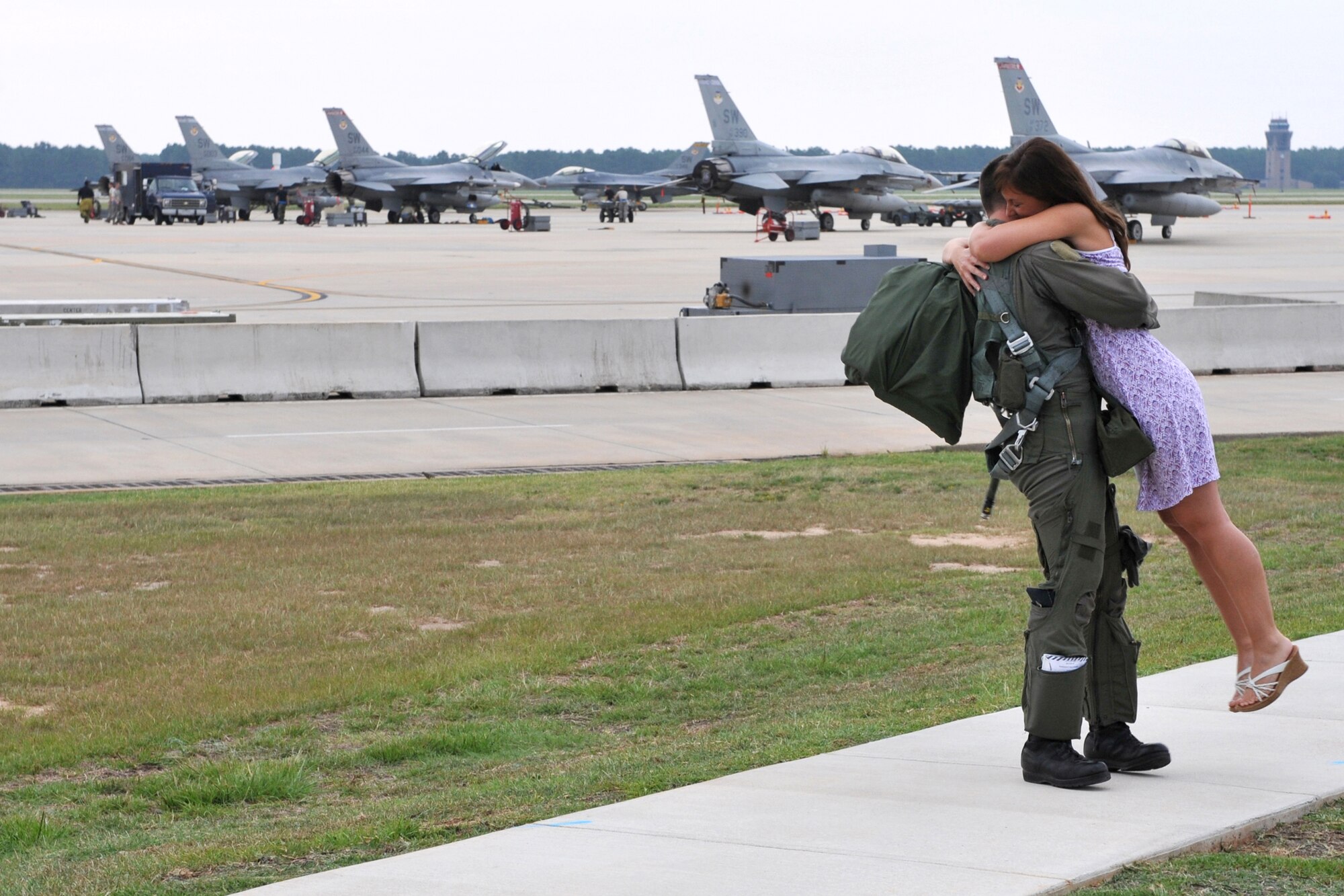 SHAW AIR FORCE BASE, S.C. -- Capt. Garrett Wilson, 55th Fighter Squadron F-16 pilot, greets a loved one upon his return from exercise Green Flag July 25. Green Flag is a two week exercise held at Nellis AFB, Nev., where pilots practice close air support tactics and techniques. (U.S. Air Force photo/Tech. Sgt. Josef Cole III)