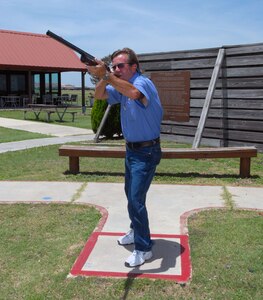 Denny Taylor, 12th Services Squadron outdoor recreation manager, takes aim at a flying clay target at the Randolph Air Force Base skeet range July 29. The skeet range recently earned, for their fifth consecutive year, "Best Small Club" from the National Skeet Shooting Association. More than 400 American shooting clubs worldwide were in the running for the title. (U.S. Air Force photo by Rich McFadden)