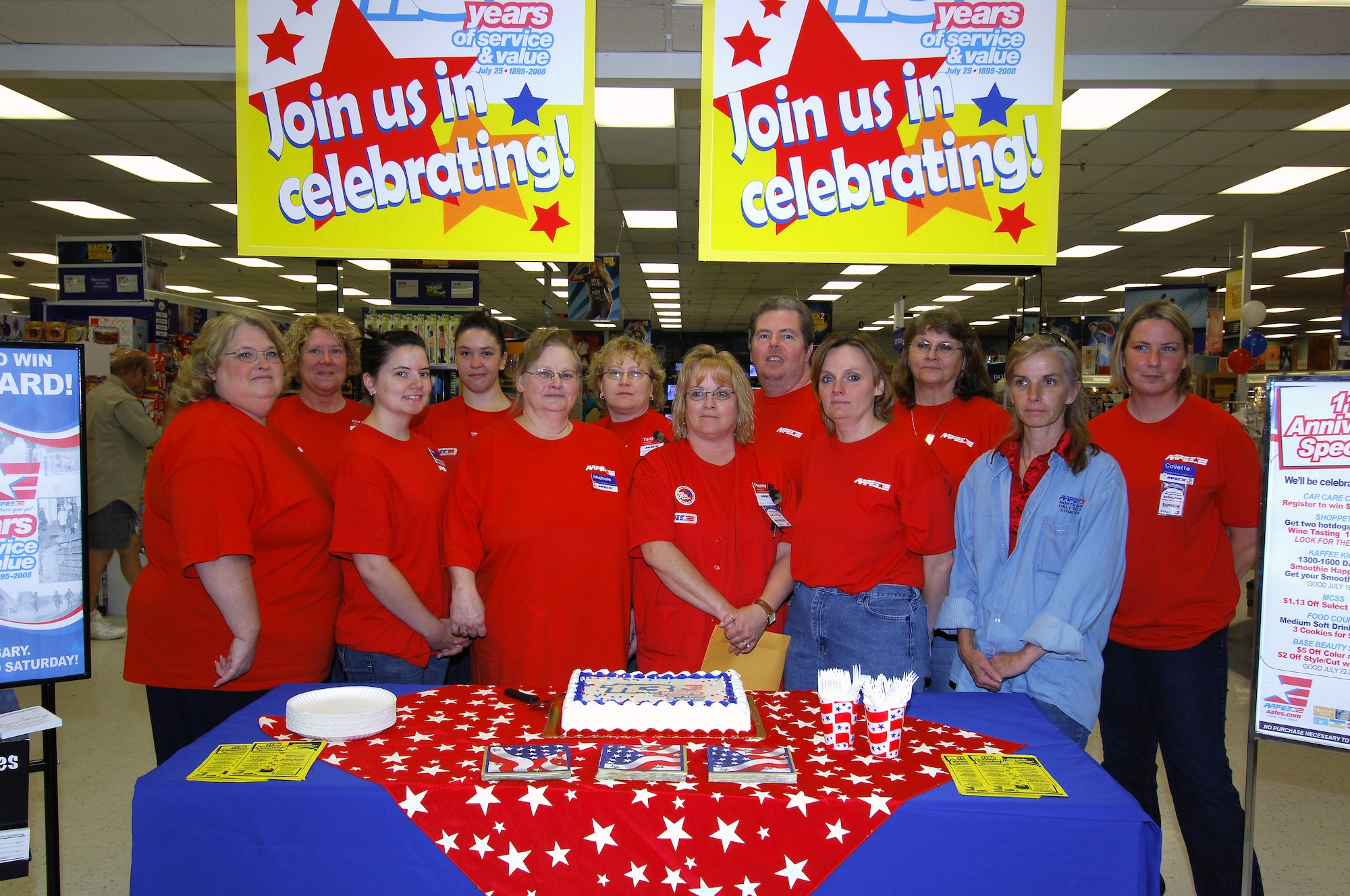 MINOT AIR FORCE BASE, N.D. -- Employees of Minot AFB Army & Air Force Exchange Service, pose for a picture during a welcome back and birthday celebration here July 25. The employees celebrated AAFES’ 113th birthday by giving out cake and coupons to customers. (U.S. Air Force photo by Senior Airman Kelly Timney)