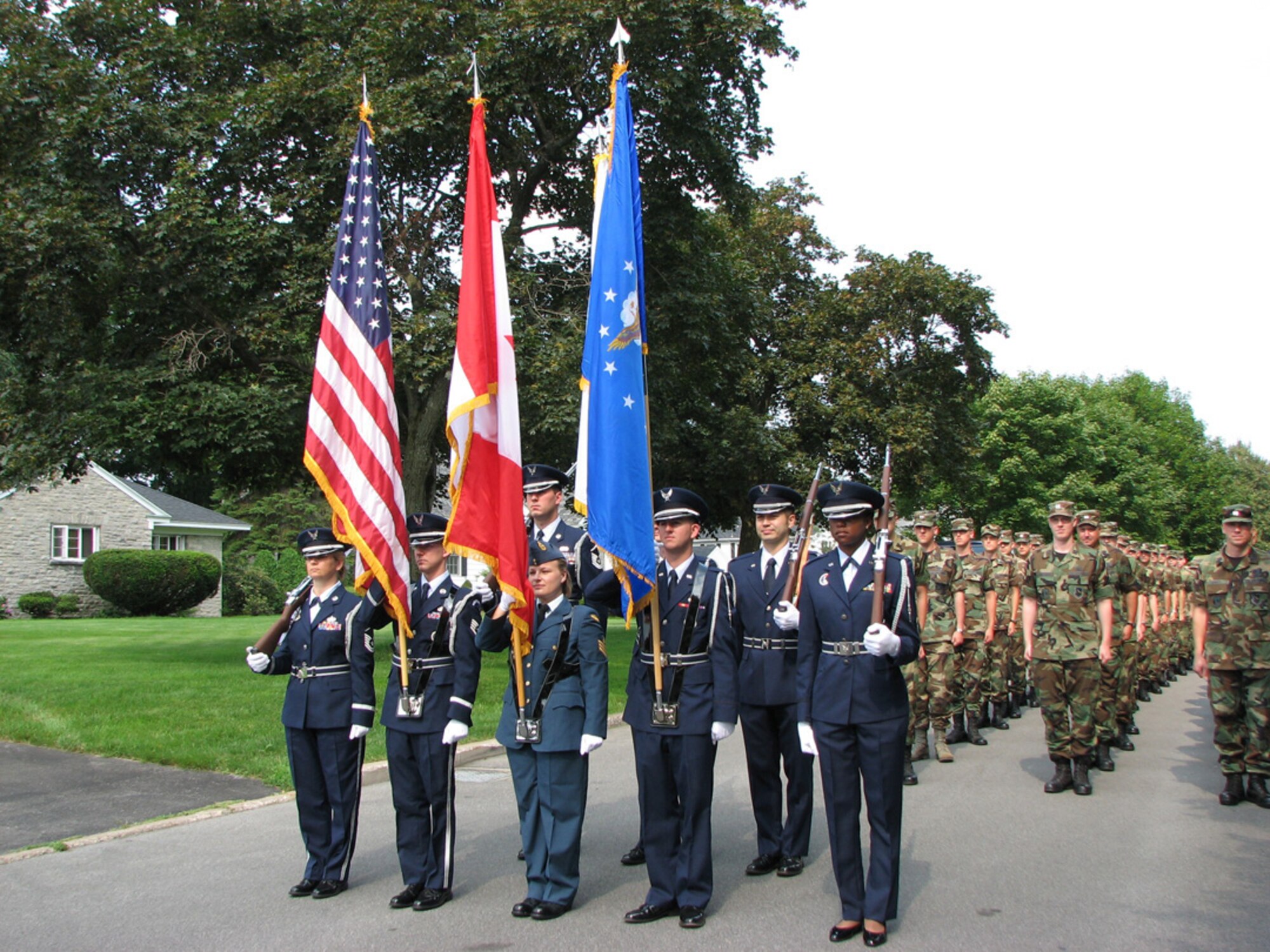 7/28/2008 - ROME, N.Y. -- Members from the Northeast Air Defense Sector stand at attention before the start of the Honor America Days Parade in Rome, N.Y. July 26. The 1.5 mile parade in Rome included a bi-national color guard and participants from NEADS, Air Force Research Laboratory, Information Directorate, and the Rome Free Academy Junior ROTC. Additionally, 2 CF-18s from the  425 Fighter Squadron, located in Bagotville, Quebec, Canada performed a flyover in honor of the North American Aerospace Defense Command's 50th Anniversary. (Photo by Master Sgt. Danny Doucette).