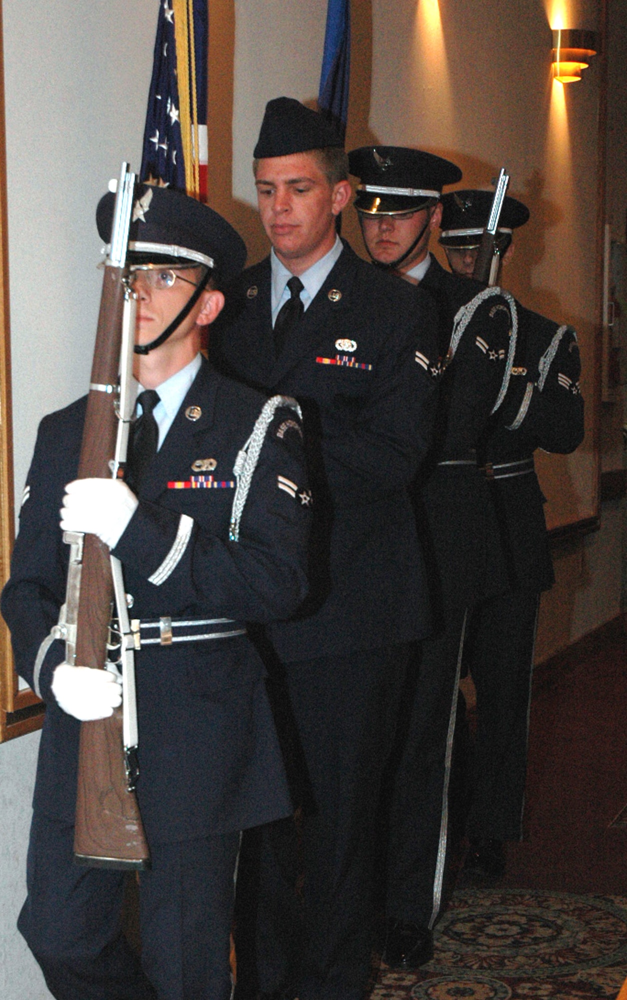 Members of the McGuire Air Force Base, N.J., Honor Guard prepare to post the colors during the 2008 McGuire Senior NCO Induction Ceremony July 25, 2008, at the McGuire Club.  More than 40 technical sergeants were recognized during the event as they prepare to enter the Air Force senior NCO corps.  (U.S. Air Force Photo/Tech. Sgt. Scott T. Sturkol)