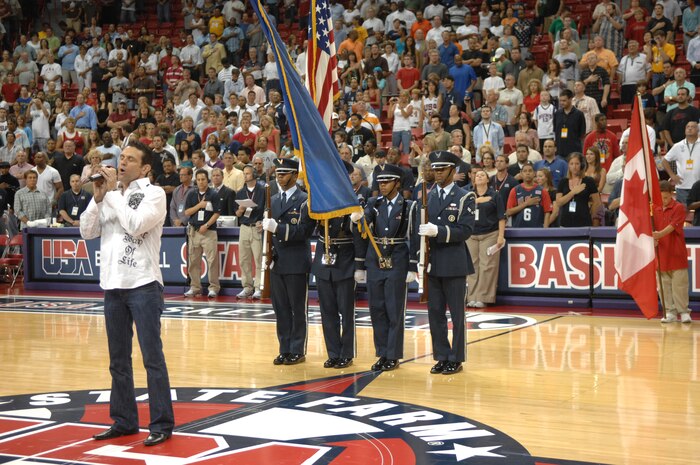 Members of the Nellis Honor Guard present the colors at a Team USA Men’s Senior National Team Exhibition Game versus Canada at a sold-out Thomas & Mack Center in Las Vegas, Nev., July 25, 2008.  Later in the game, ten Airmen, recent returnees from deployments in OIF and OEF, were honored in recognition for their contributions to the nation’s war efforts.(U.S. Air Force photo: by Senior Airman Brian Ybarbo) 