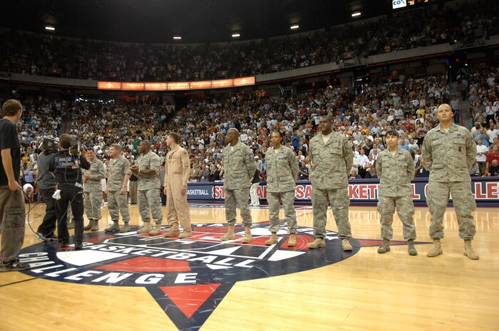Ten Airmen from Nellis and Creech Air Force Bases are honored during the third quarter of theTeam USA Men’s Senior National Team Exhibition Game versus Canada at a sold-out Thomas & Mack Center in Las Vegas, Nev., July 25, 2008.  The Airmen, recent returnees from deployments in OIF and OEF, were honored in recognition for their contributions to the nation’s war efforts.(U.S. Air Force photo: by Senior Airman Brian Ybarbo) 