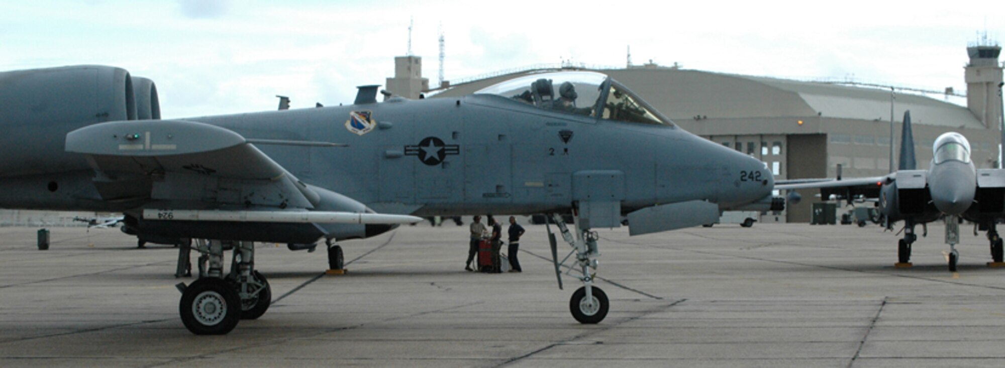 An A-10 Thunderbolt II rolls by a 53d Wing F-15 on its way to take off for a mission in support of the Bold Quest Plus demonstration. A-10s, F-15s, F-16s and 132 personnel from the 422nd TES at Nellis Air Force Base, Nev., were brought in by the 53rd Wing to help the international Bold Quest players demonstrate and evaluate new equipment. (US Air Force photo/ Airman 1st Class Anthony Jennings)