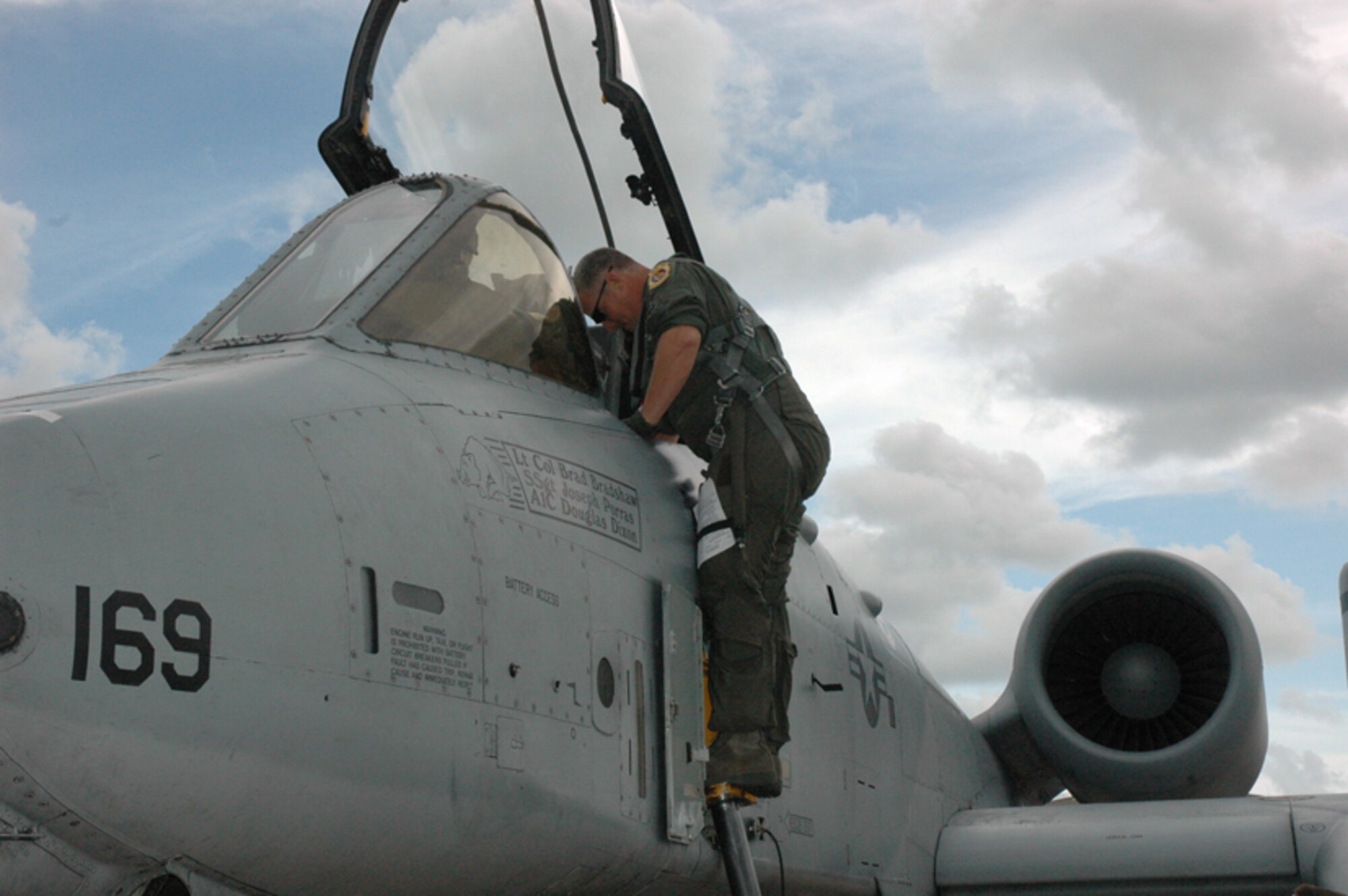 Lt. Col. Brad Bradshaw, 422 Test and Evaluation Squadron, climbs aboard his A-10 Thunderbolt II before the Bold Quest Plus demonstration. A-10s, F-15s, F-16s and 132 personnel from the 422nd TES at Nellis Air Force Base, Nev., were brought in by the 53rd Wing to help the international Bold Quest players demonstrate and evaluate new equipment. (US Air Force photo/ Airman 1st Class Anthony Jennings)