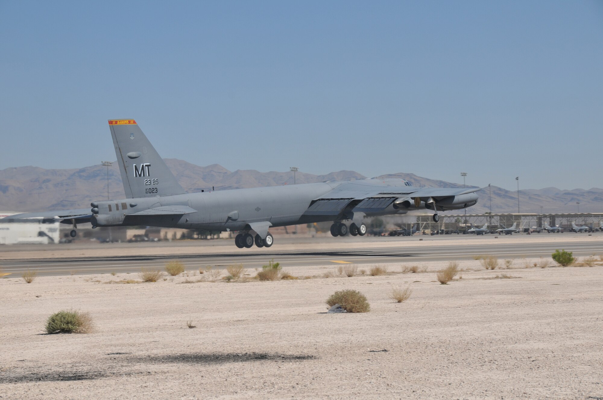 NELLIS AIR FORCE BASE, Nev. -- A B-52H Stratofortress from the 23rd Bomb Squadron at Minot Air Force Base takes off into the desert sky during a training mission here July 25 as part of Red Flag 08-03. Red Flag is a two-week, realistic combat training exercise involving the air forces of the United States and its allies. Almost 150 Warbirds are participants in the exercise which ends Aug. 1. (Courtesy photo)