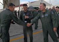 Maj. Gen. Irving Halter, outgoing 19th Air Force commander, was honored by fellow Airmen, friends and family during his final, or "fini," flight July 28. General Halter flew a T-38 Talon for his flight and upon his return was welcomed by firefighters dousing him with hundreds of gallons of water and friends and family showering him with warm wishes. The general will turn over command of the 19th AF in a ceremony here July 30 and head to his new assignment as Joint Staff vice director of operations at the Pentagon in Washington, D.C. (U.S. Air Force photo by Rich McFadden) 