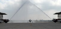 Maj. Gen. Irving Halter, outgoing 19th Air Force commander, was honored by fellow Airmen, friends and family during his final, or "fini," flight July 28. General Halter flew a T-38 Talon for his flight and upon his return was welcomed by firefighters dousing him with hundreds of gallons of water and friends and family showering him with warm wishes. The general will turn over command of the 19th AF in a ceremony here July 30 and head to his new assignment as Joint Staff vice director of operations at the Pentagon in Washington, D.C. (U.S. Air Force photo by Rich McFadden) 