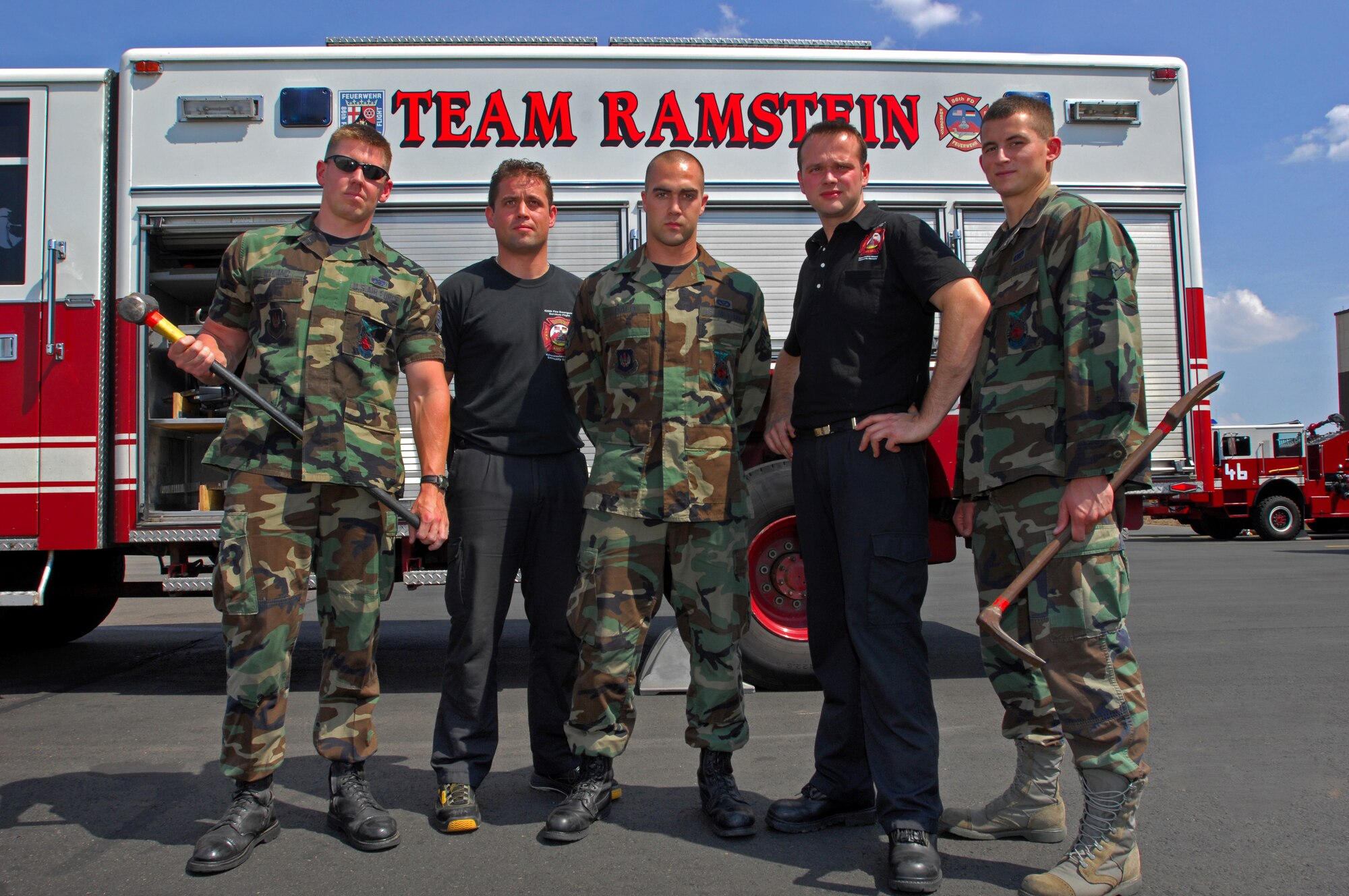 The 435th Civil Engineering Squadron Fire Department is made up of both U.S. Military and Local National personnel. Together they work hand in hand to meet the demands of their mission under the 435th and United States Air Forces in Europe. pictured in this photo is (from left) Staff Sgt. Brian Hyland, Mr. Stefan Domis, Senior Airman Antony Dalo, Mr. Diehl Wolfgang, and Airman David Thal (U.S. Air Force photo/Airman 1st Class Kenny Holston)(RELEASED)