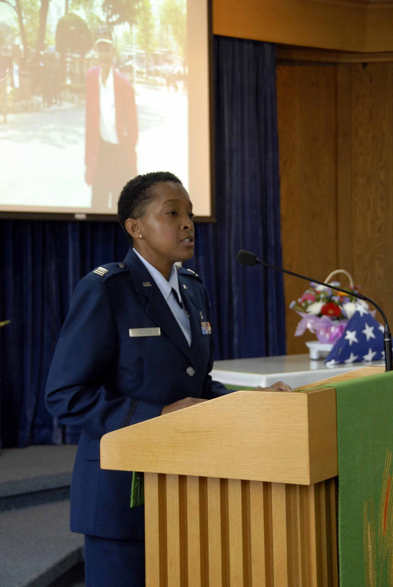 OSAN AIR BASE, Republic of Korea -- Sok Kyun Price, (center), wife of the  late Master Sgt. (retired) James T. Price, receives condolences from members of the local Veterans Foreign Wars Association during a memorial service held for Sergeant Price at the base chapel here July 29. Sergeant Price was one of the youngest members of the famous Tuskegee Airmen and mentor to the Osan Air Base community. (U.S. Air Force photo/Staff Sgt. Lakisha Croley)
