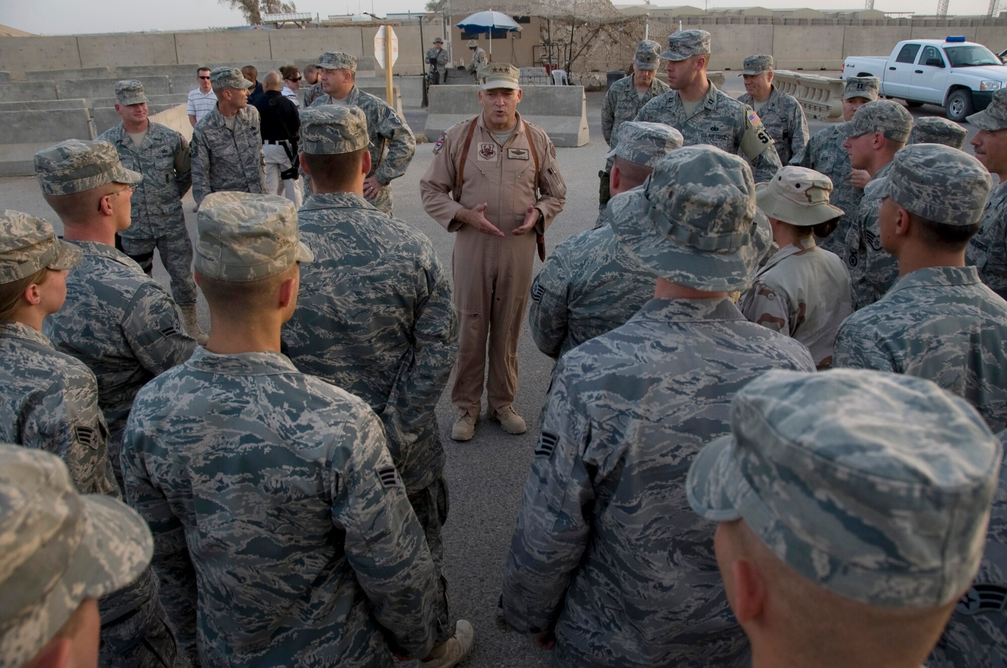 ALI BASE, Iraq -- Lt. Gen. Gary North, U.S. Air Forces Central and 9th Air Force commander, thanks members of the 407th Expeditionary Security Forces Squadron for protecting other Airmen around the clock and keeping deployed locations as safe as possible. General North, along with Chief Master Sgt. Scott Dearduff, USAFCENT command chief master sergeant, stopped here July 28, 2008 to see recent improvements and to thank Airmen for their service to their country. (U.S. Air Force photo/Airman 1st Class Christopher Griffin)