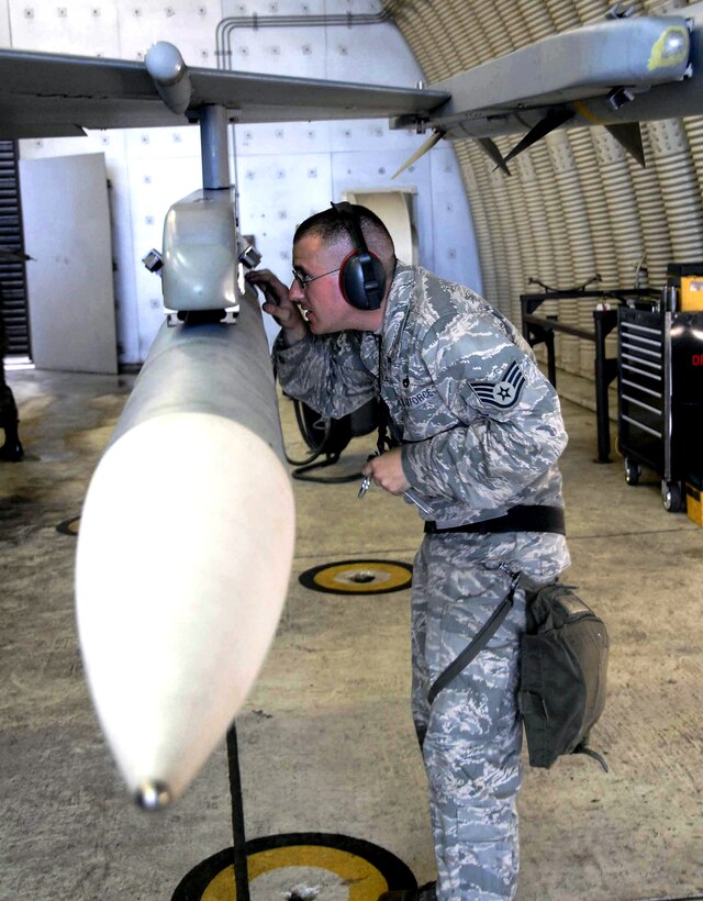 U.S. Air Force Staff Sgt. Andrew Stover inspects the AIM-120 connections on an F-16 Fighting Falcon during an exercise on Osan Air Base, South Korea, July 21, 2008. Stover is a weapons loader assigned to the 51st Aircraft Maintenance Squadron.
