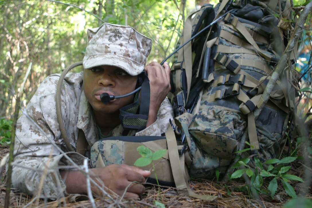 A Marine with U.S. Marine Corps Forces, Special Operations Command calls the communications operations center to let them know the position of his team here, July 30. As a student in the Marine Network Operators Course, he is taught to be a subject matter expert in communications.