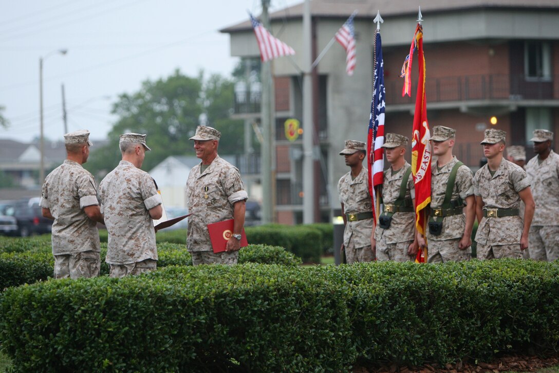 Maj. Gen. Carl B. Jensen takes command of Marine Corps Installations East from Maj. Gen. Robert C. Dickerson Jr., during a ceremony held in the traffic circle on Holcomb Boulevard here July 30.  Maj. Gen. Jensen congratulated Maj. Gen. Dickerson on his retirement and all he had achieved, asking him if he would dismiss the command at the end of the ceremony.  He also spoke on his plans for the future saying, "I'm going to build upon your success and bring this community to new heights.  It's a great assignment, and I look forward to it."