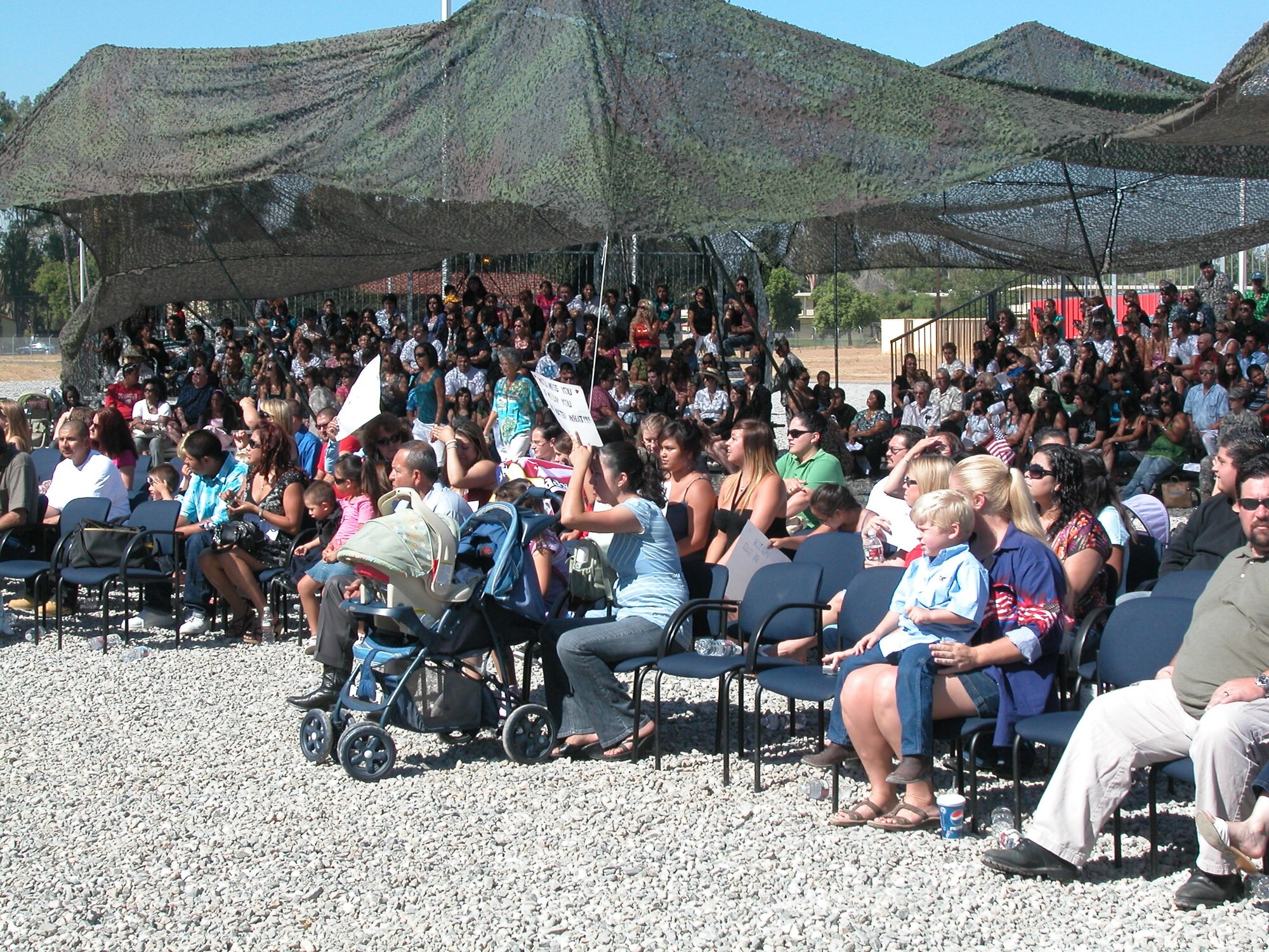 A WARM SEND-OFF: Some 200 soldiers from the 1498th Transportation Company, California Army National Guard, are given a send-off by their unit and the community at March Air Reserve Base as they head out for a one-year deployment in Iraq. More than 700 family members attended the event which will be their last physical contact with the Soldiers until they return in 2009. Brigadier Gen. Keith Jones, Assistant Deputy Adjutant General for California; Wally Rice, representative for Riverside County Supervisor Marion Ashley; Riverside Councilman Steve Adams and Colonel Lisa Constanza, 224th Sustainment Brigade commander, were a few of the guests present. After the formal ceremony, the troops and their families were treated to lunch at their unit while the children enjoyed playing on a bouncer and having a clown paint their faces. (U.S. Air Force photo by Maj Don Traud, 452 AMW/PA